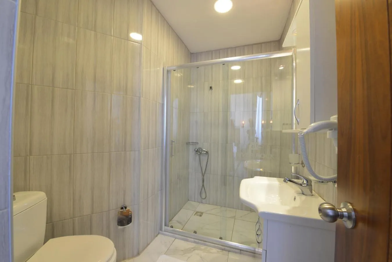 Bathroom in Olimpos Beach Hotel by RRH&R