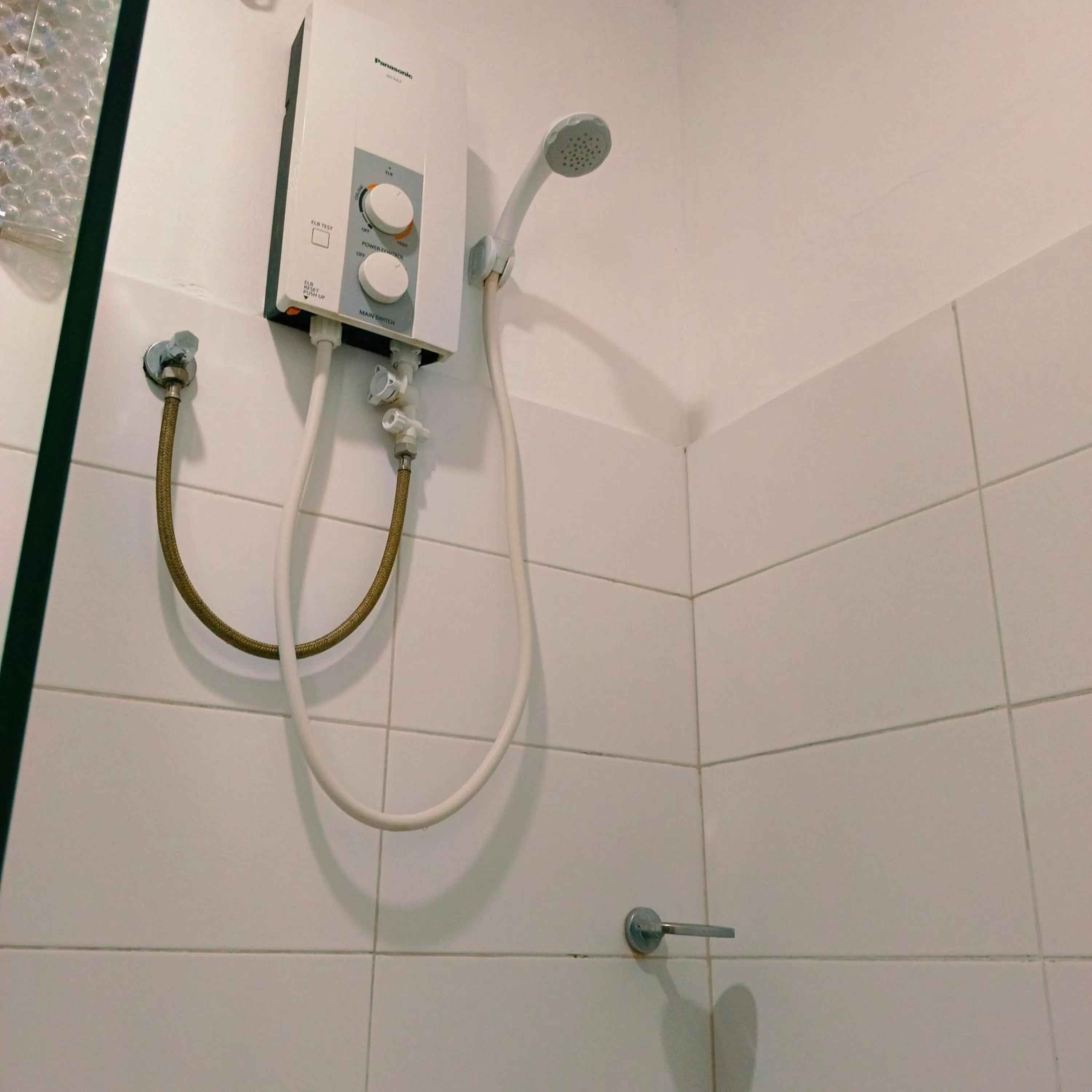 Shower in The Strand Suites and Dormitel
