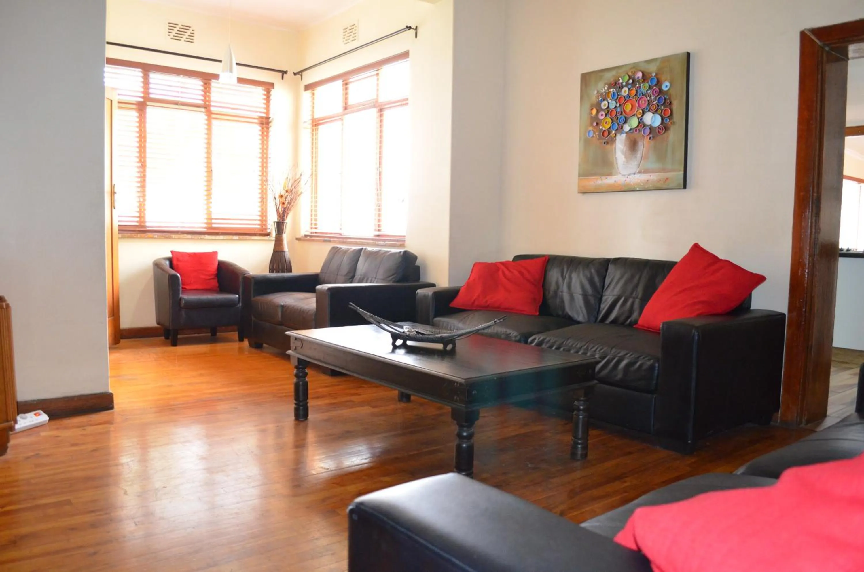 Communal lounge/ TV room in A Sunflower Stop Backpackers