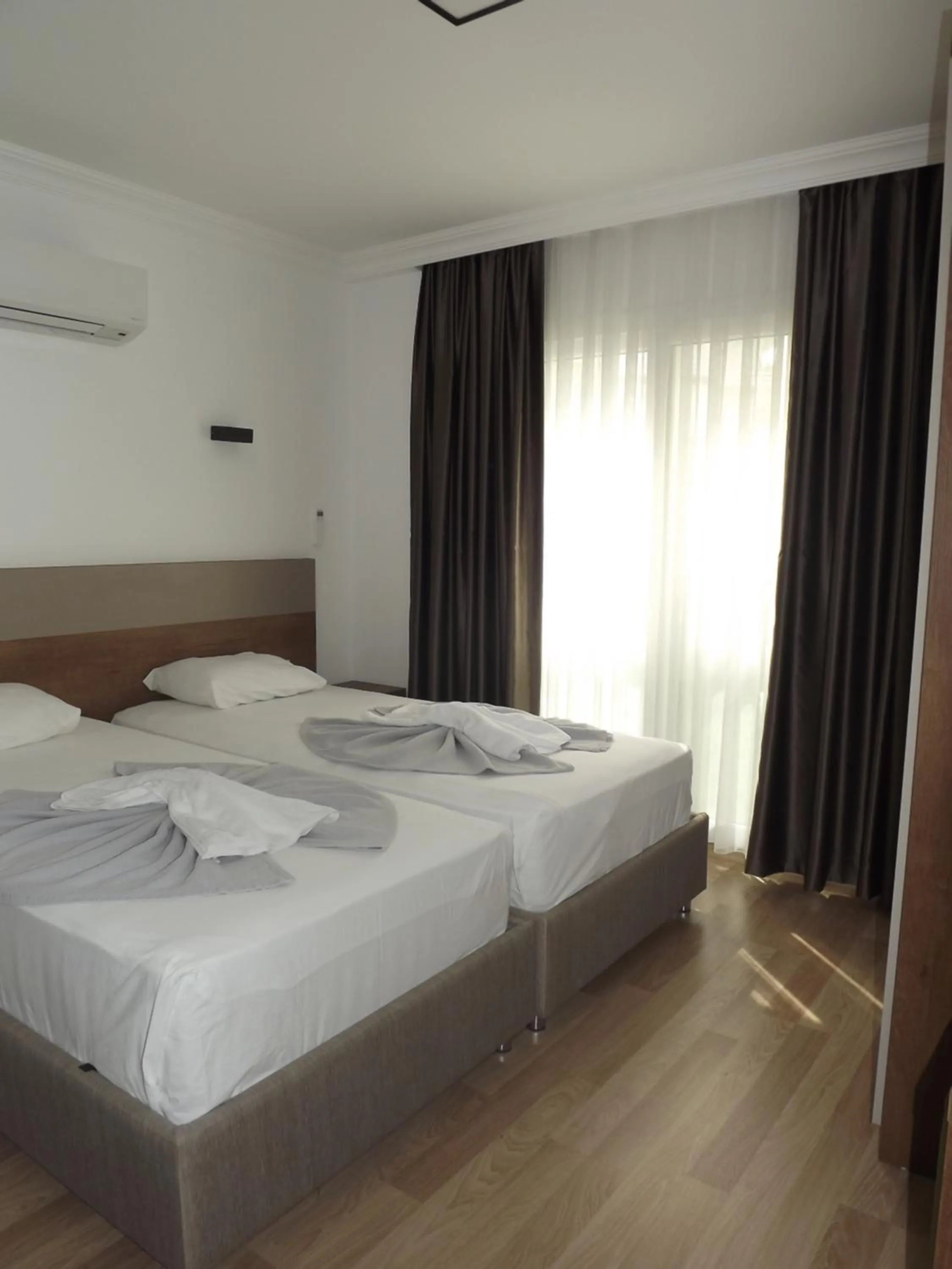 Bed in Opus Apart Hotel