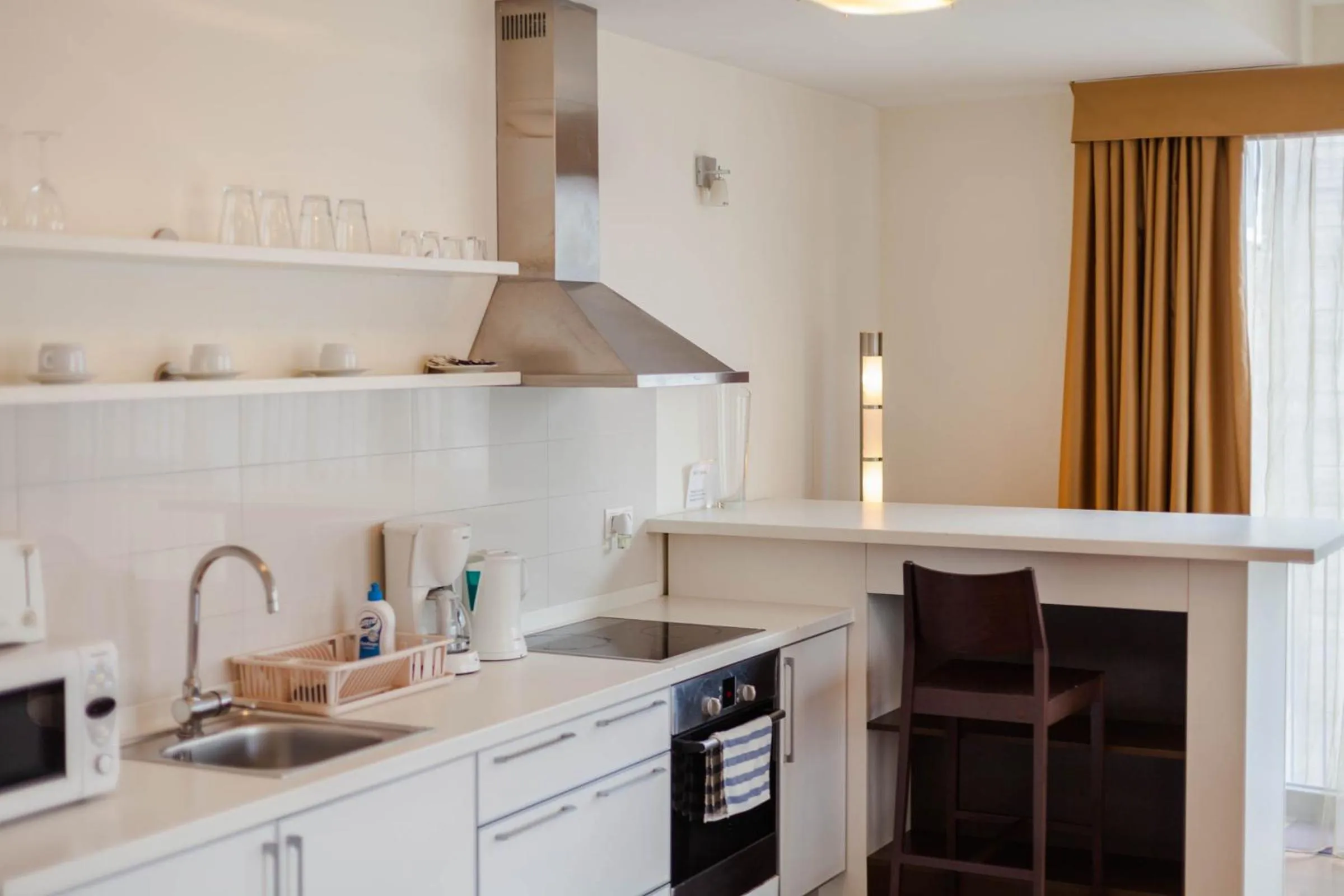 Kitchen or kitchenette in City Gardens Hotel & Wellness