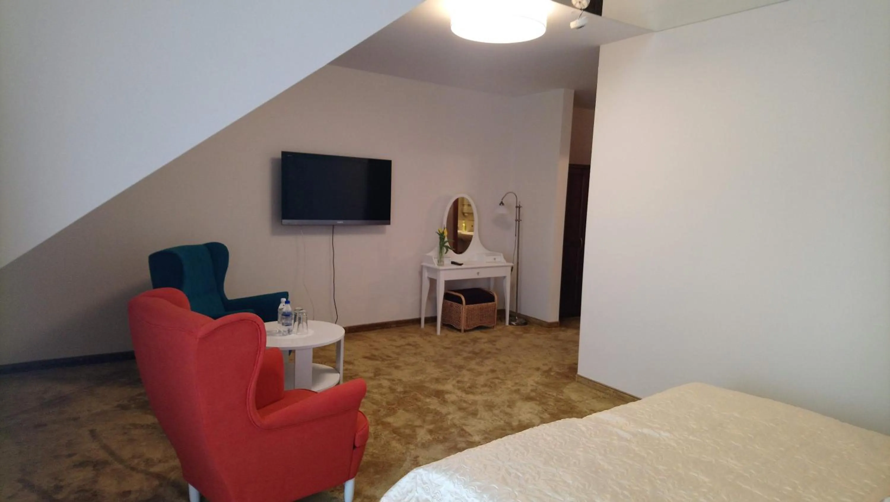 Living room, Bed in Hotel Milord