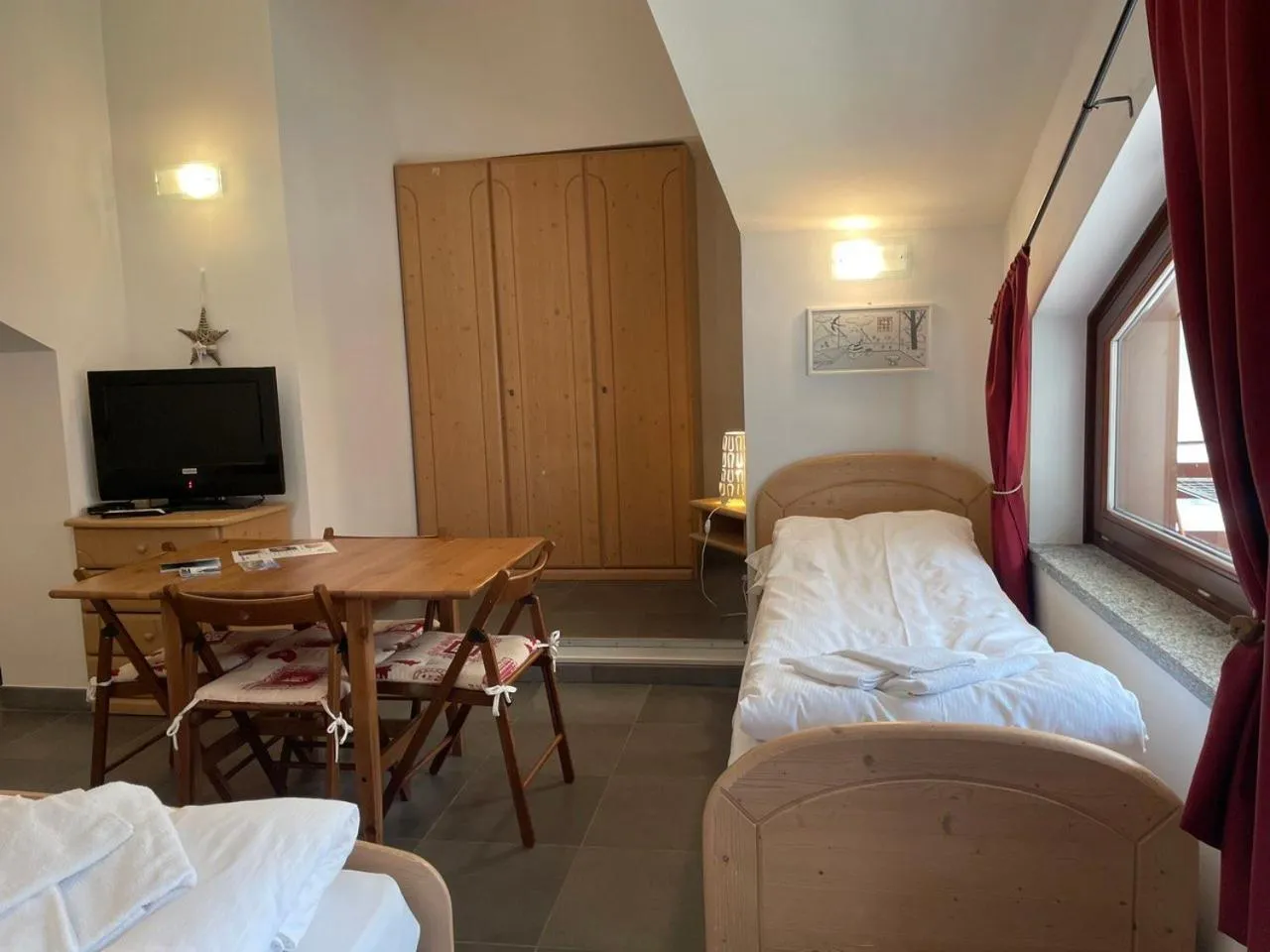 Living room, Bed in Residence Le Marmotte