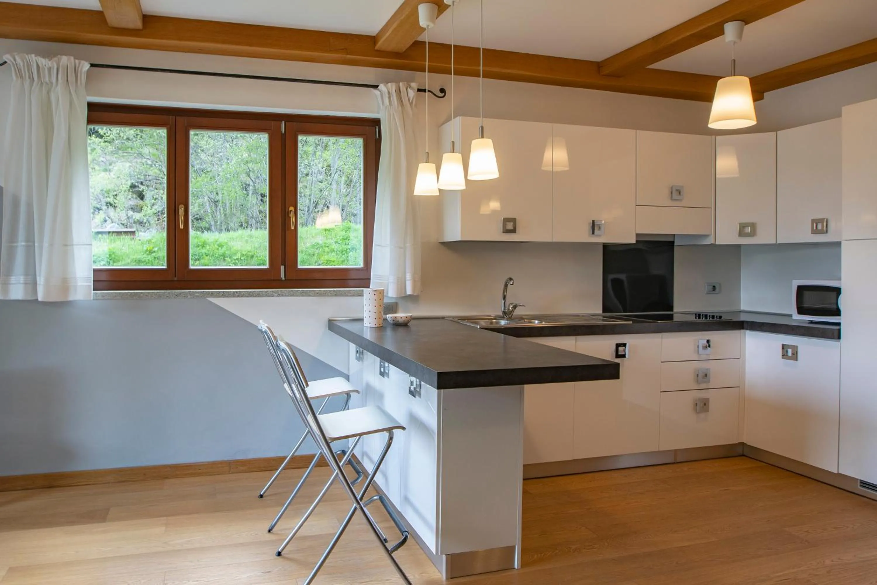 Kitchen or kitchenette in Residence Le Marmotte