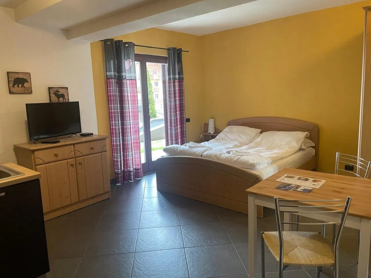 Living room, Bed in Residence Le Marmotte