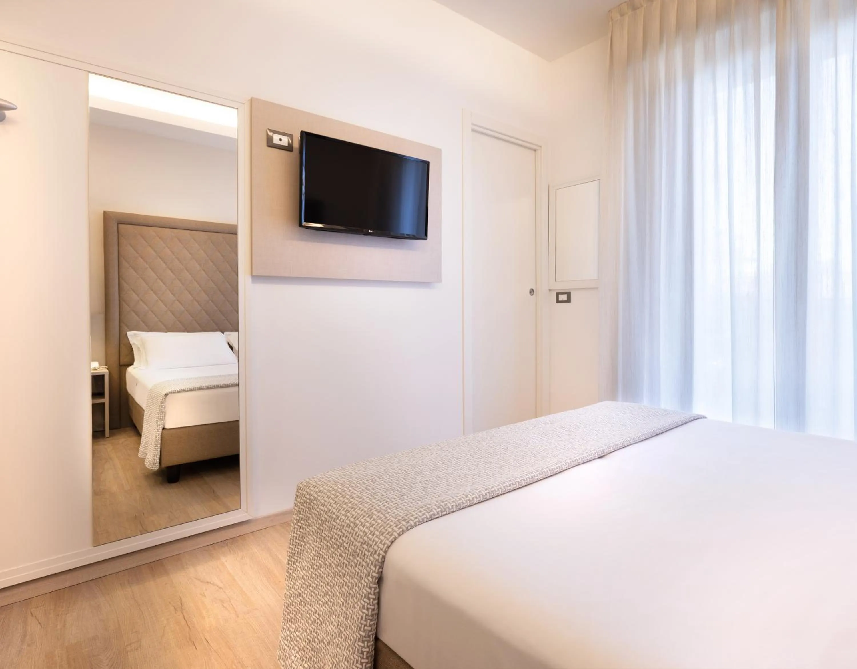 Bed in Hotel Riviera