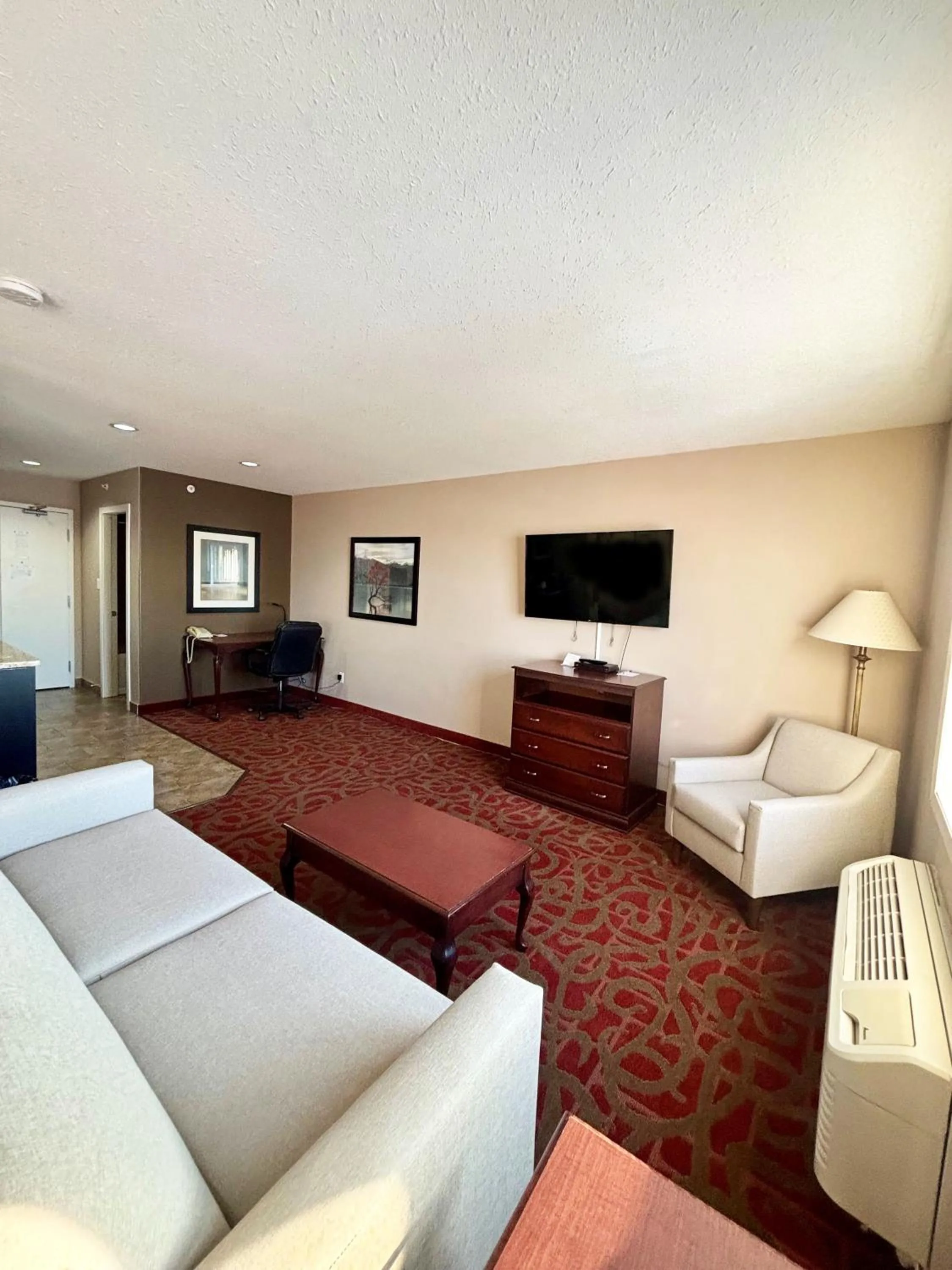 Living room in Ramada by Wyndham Sherwood Park