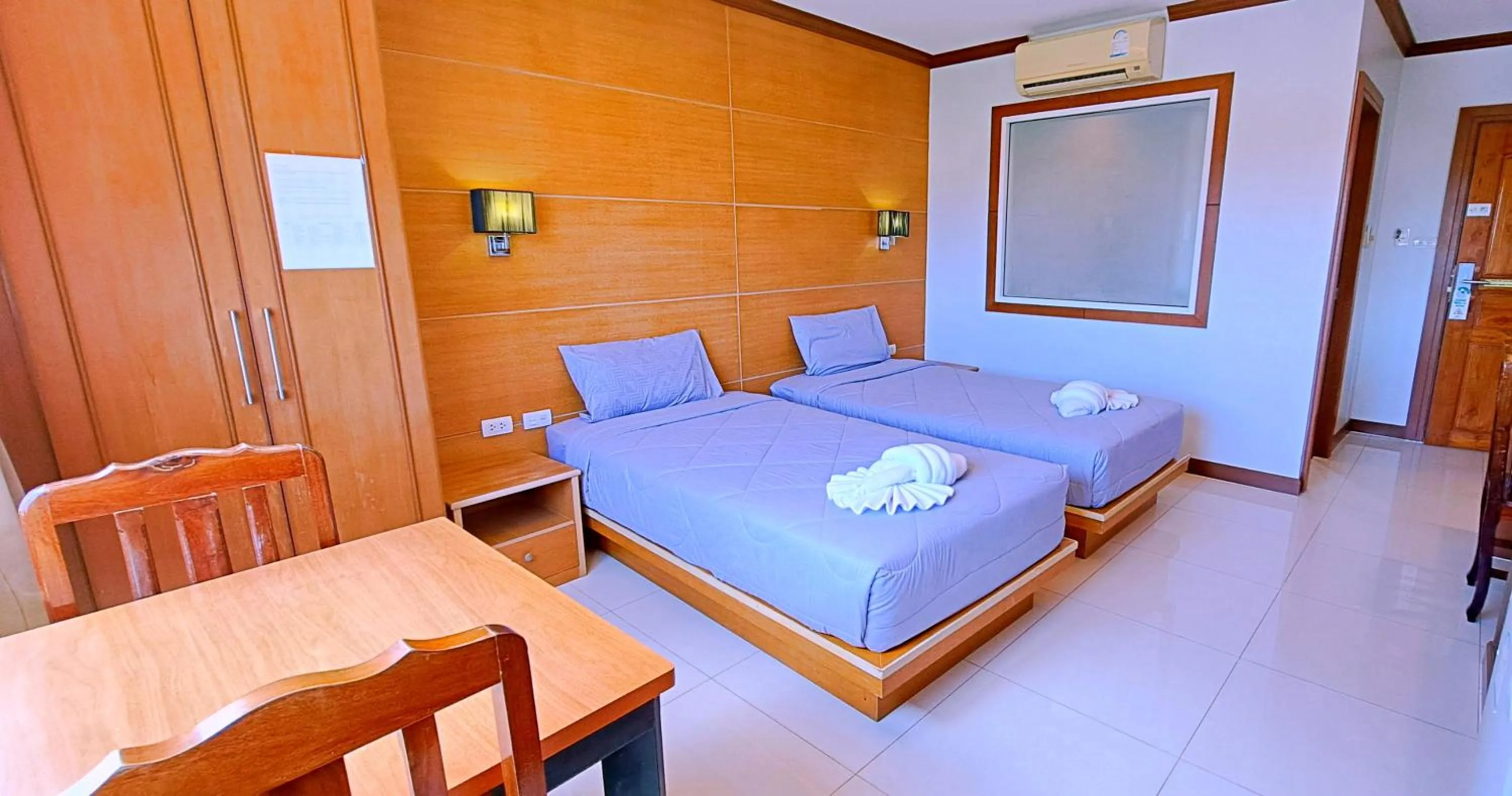 Bed in Green Harbor Hotel & Service Apartment