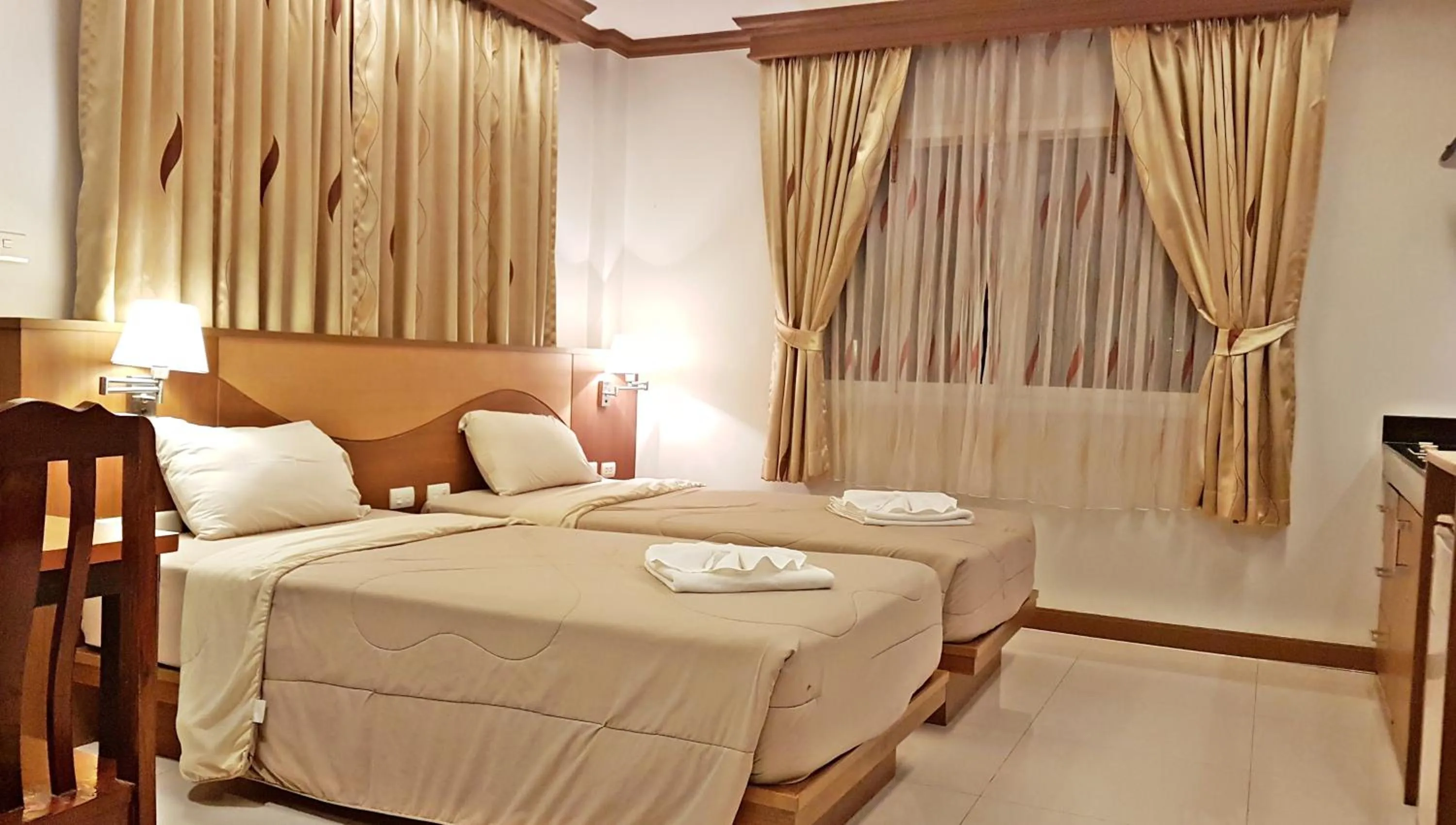 Bed in Green Harbor Hotel & Service Apartment