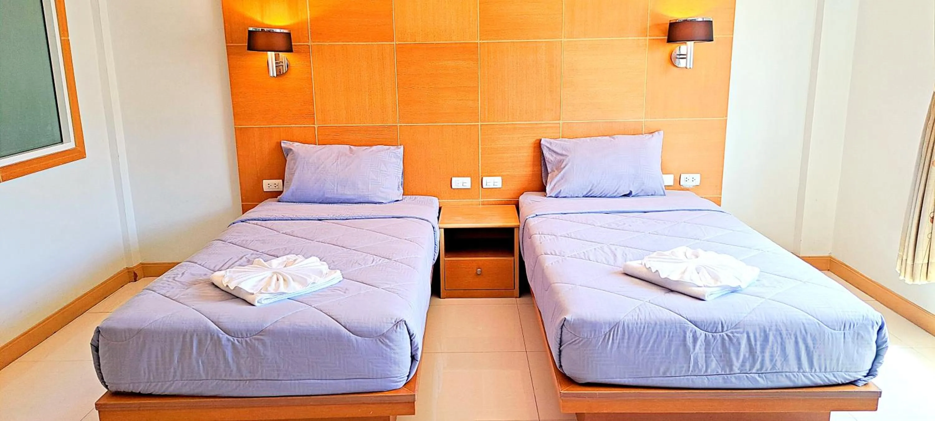 Bed in Green Harbor Hotel & Service Apartment