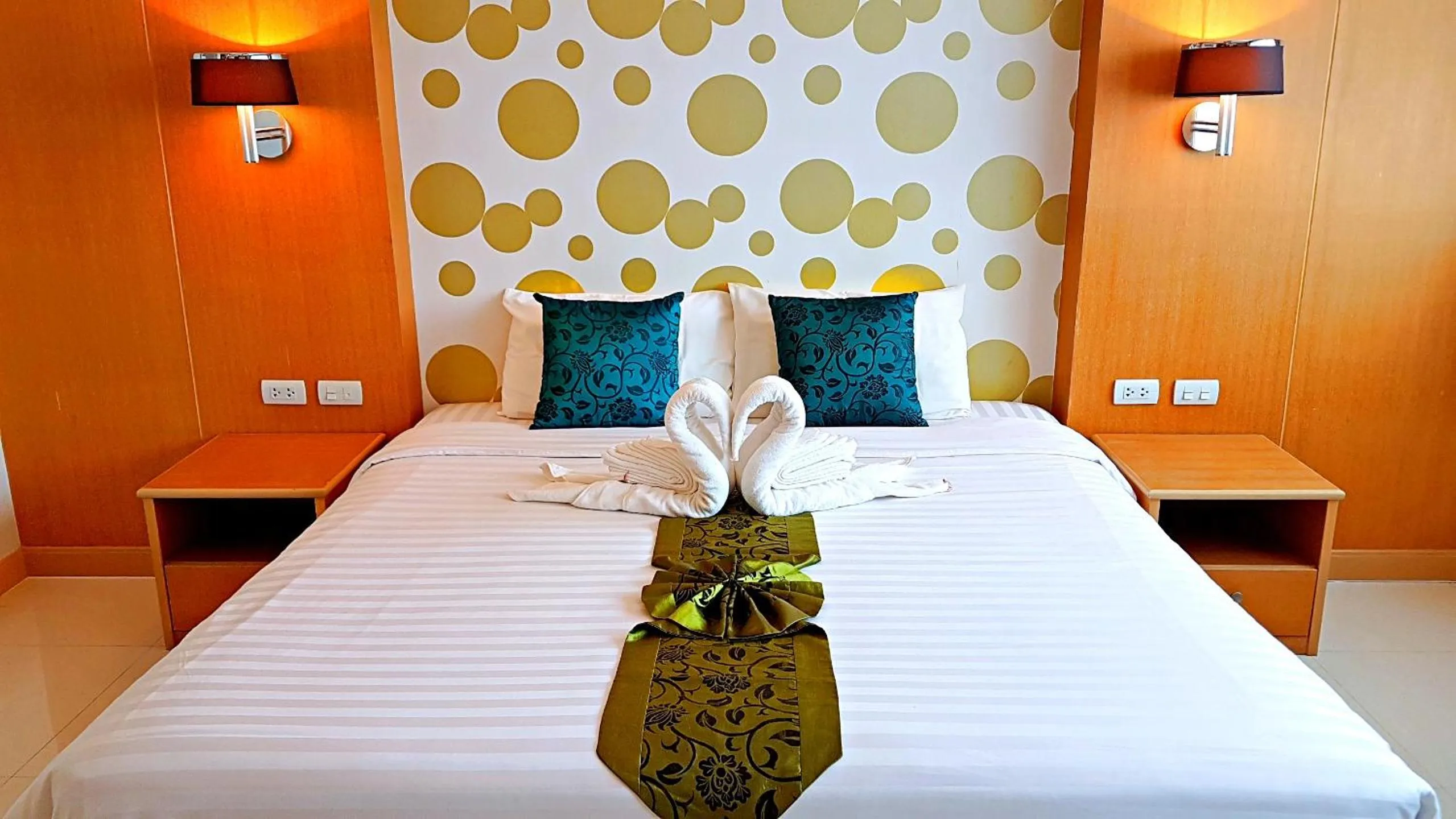 Bed in Green Harbor Hotel & Service Apartment