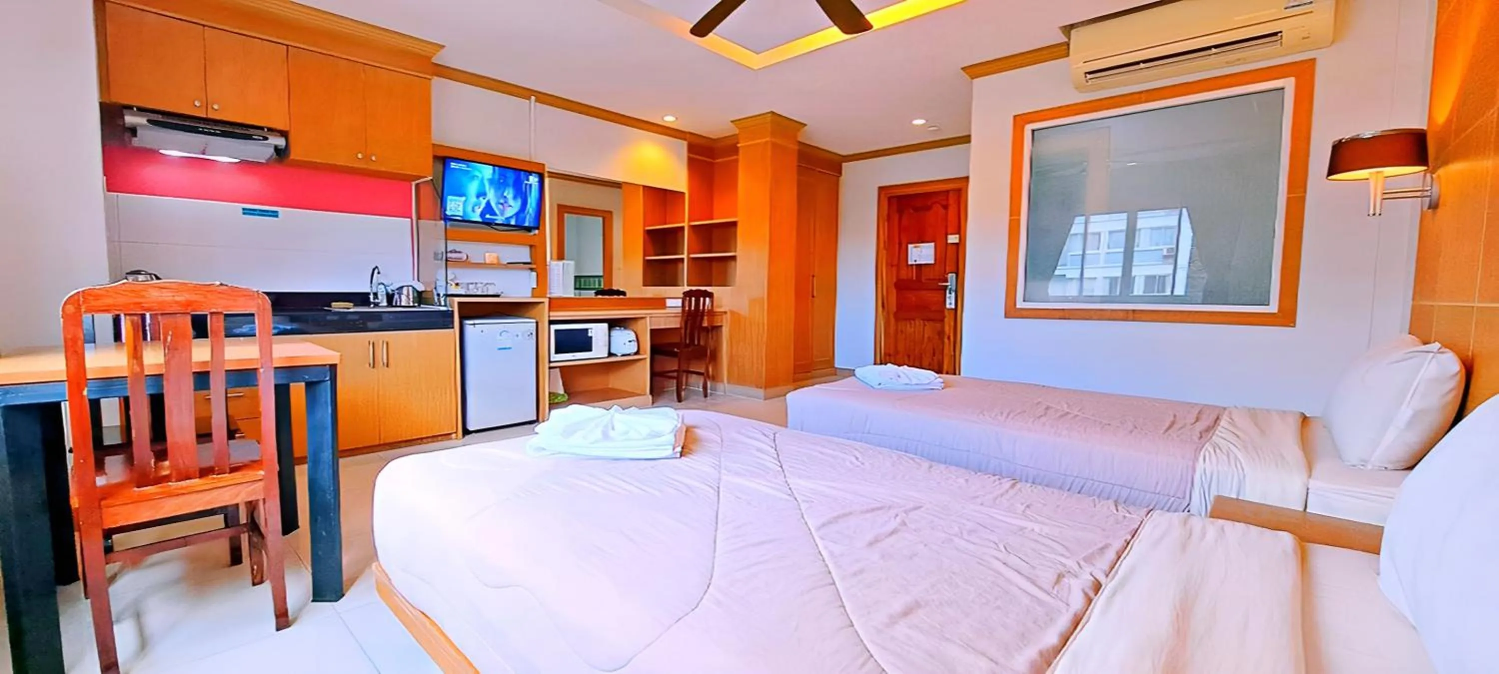 Photo of the whole room, Bed in Green Harbor Hotel & Service Apartment