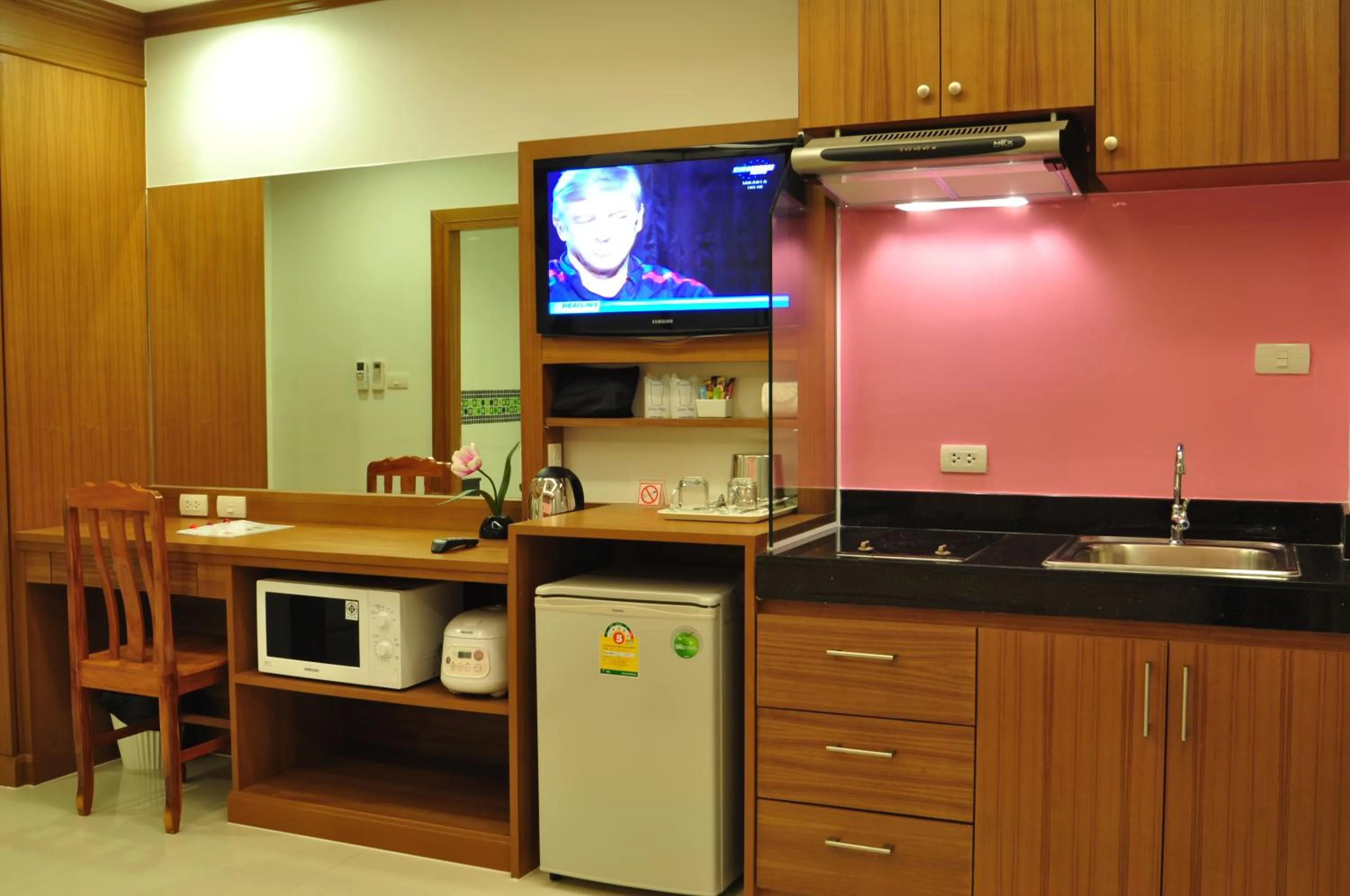Kitchen or kitchenette in Green Harbor Hotel & Service Apartment