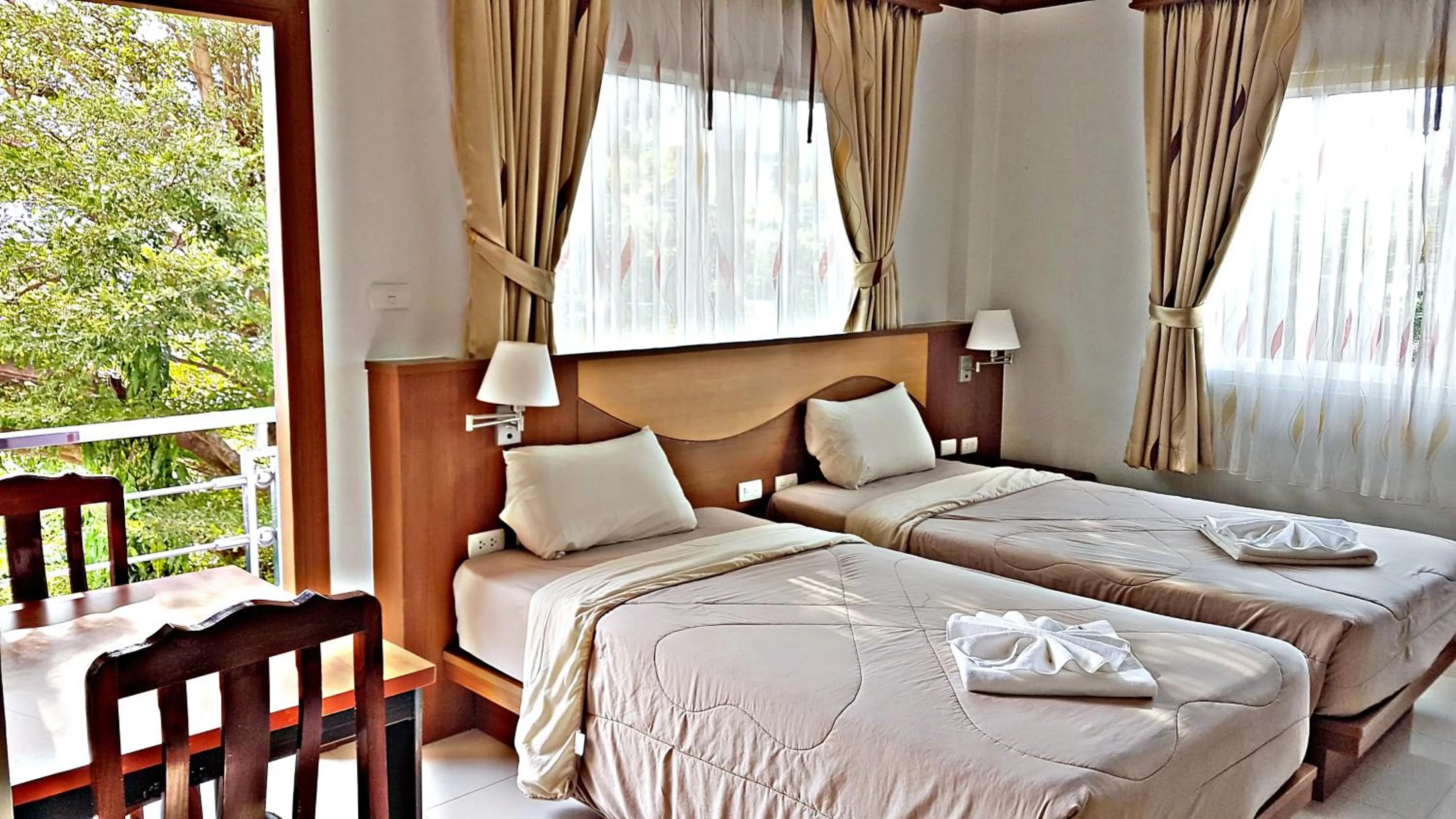 Bed in Green Harbor Hotel & Service Apartment