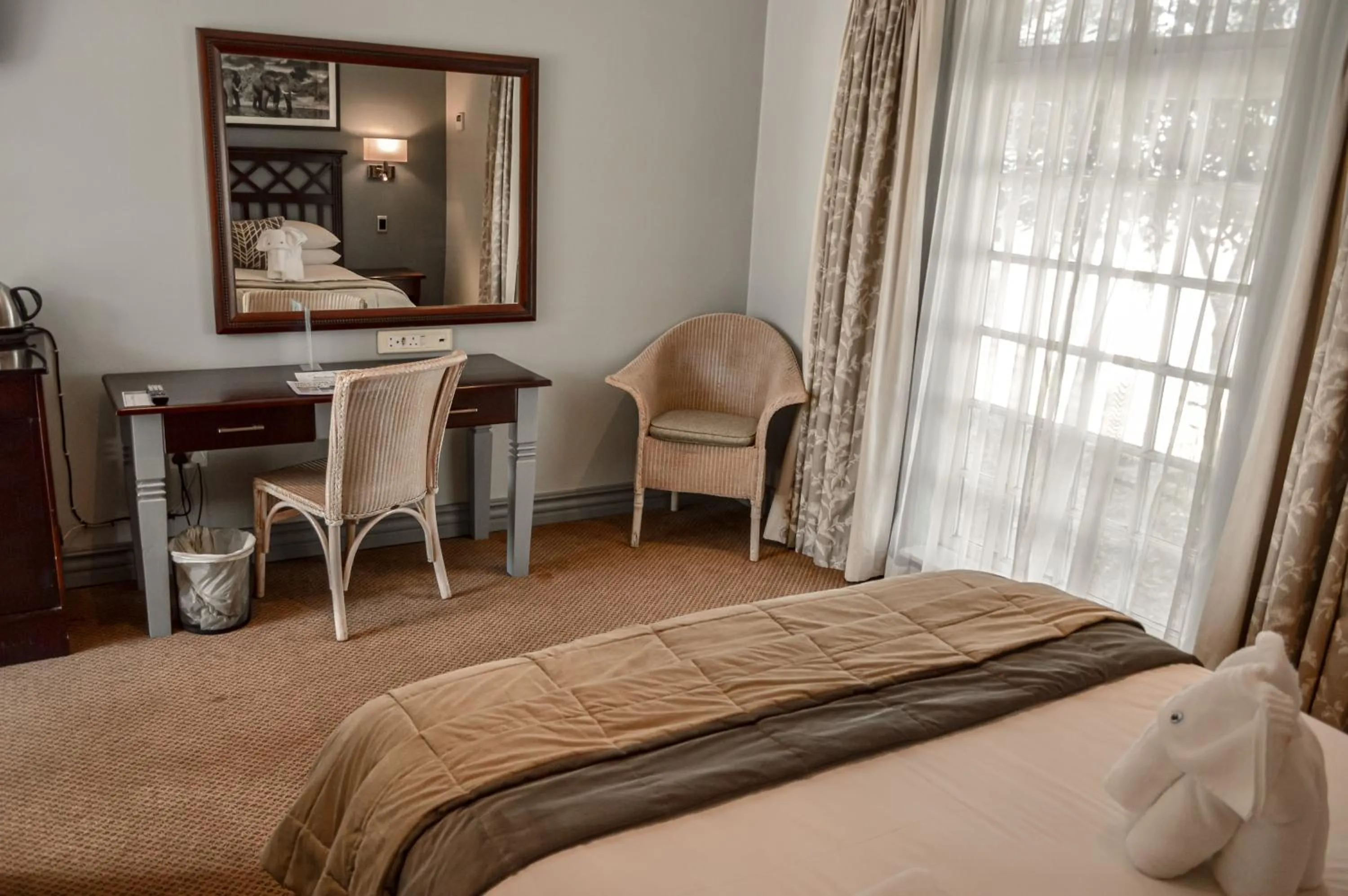 Living room, Bed in Indaba Hotel, Spa & Conference Center