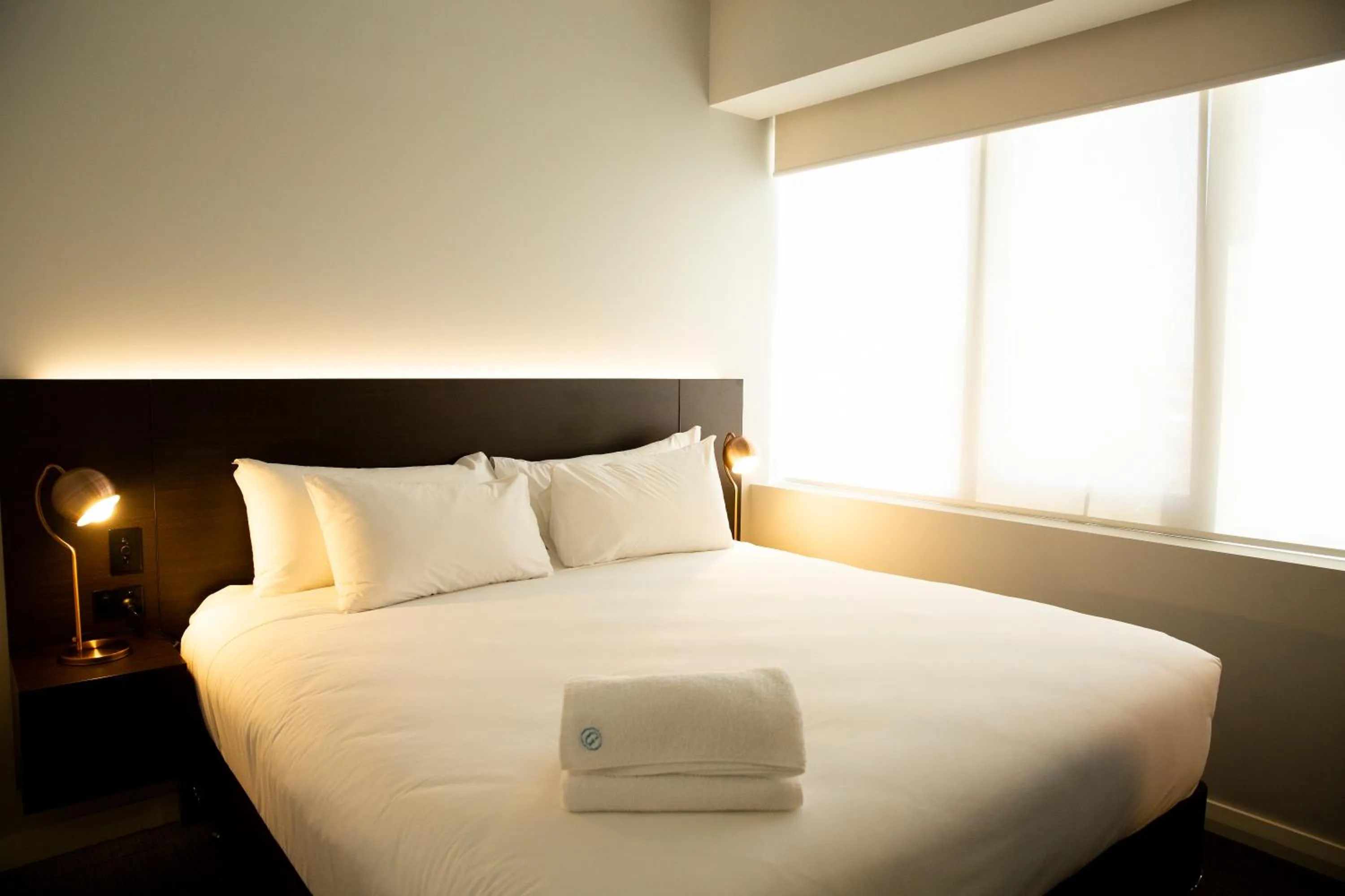 Bed in The Gerald Apartment Hotel