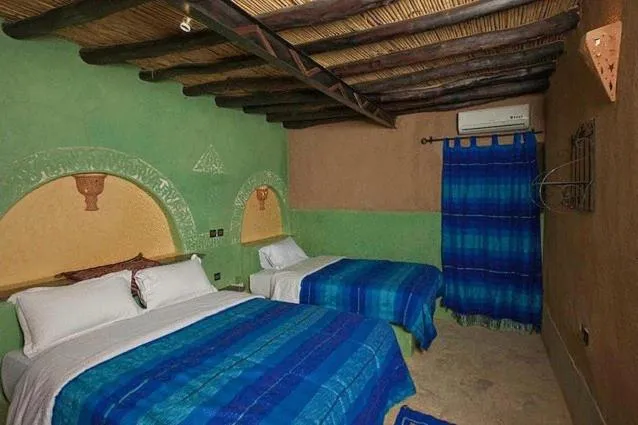 Bed in Palmeras Y Dunas Luxery Camp