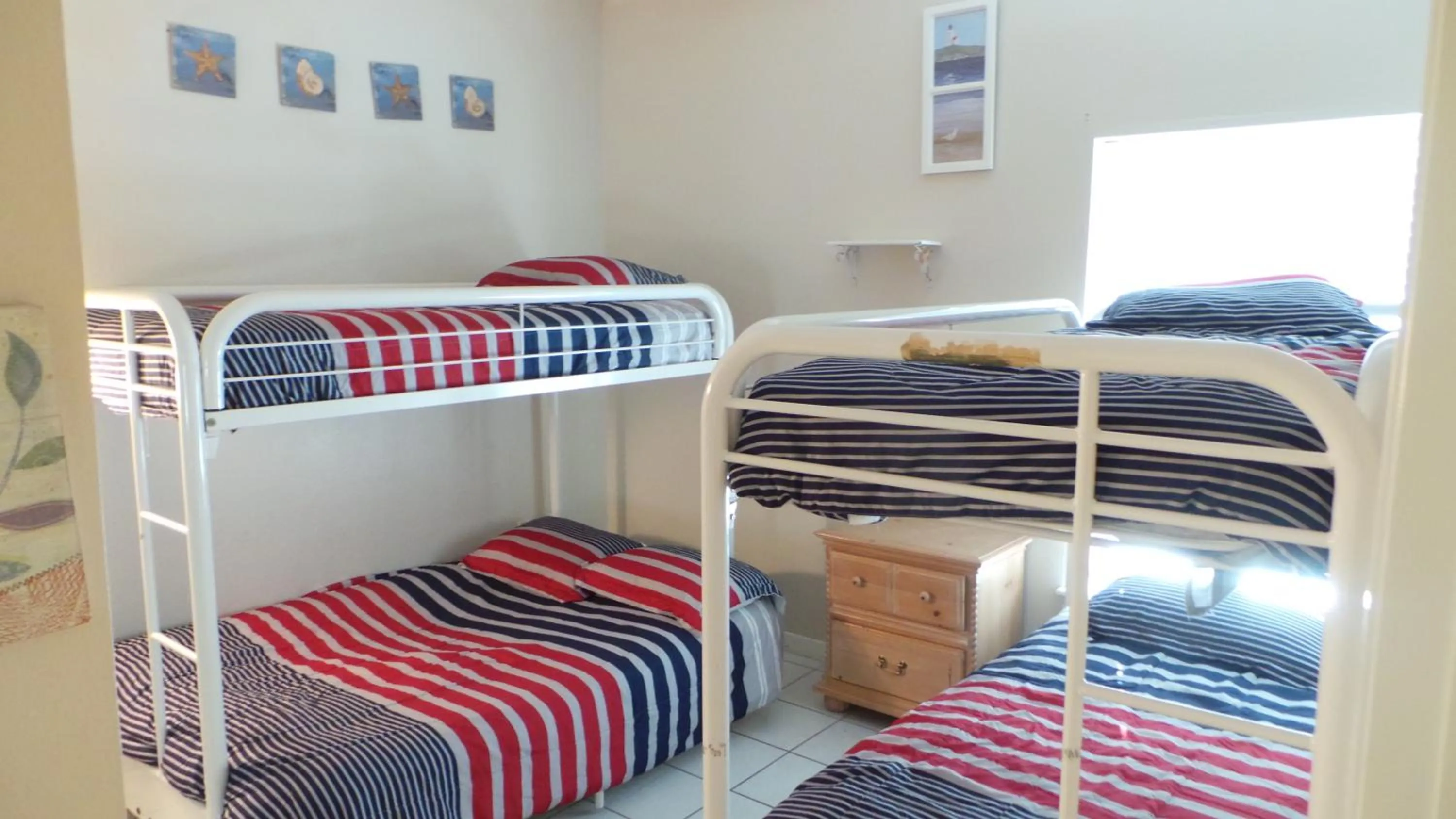 Bedroom, Bed in The Dunes Condominiums by Cheap Getaway