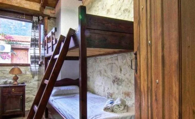 Bed in Stone Village Hotel Apartments