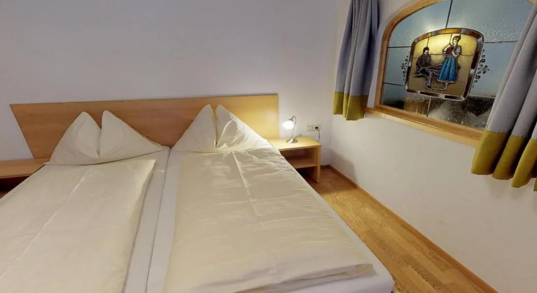 Bed in Hotel Wechselberger by Alpeffect Hotels