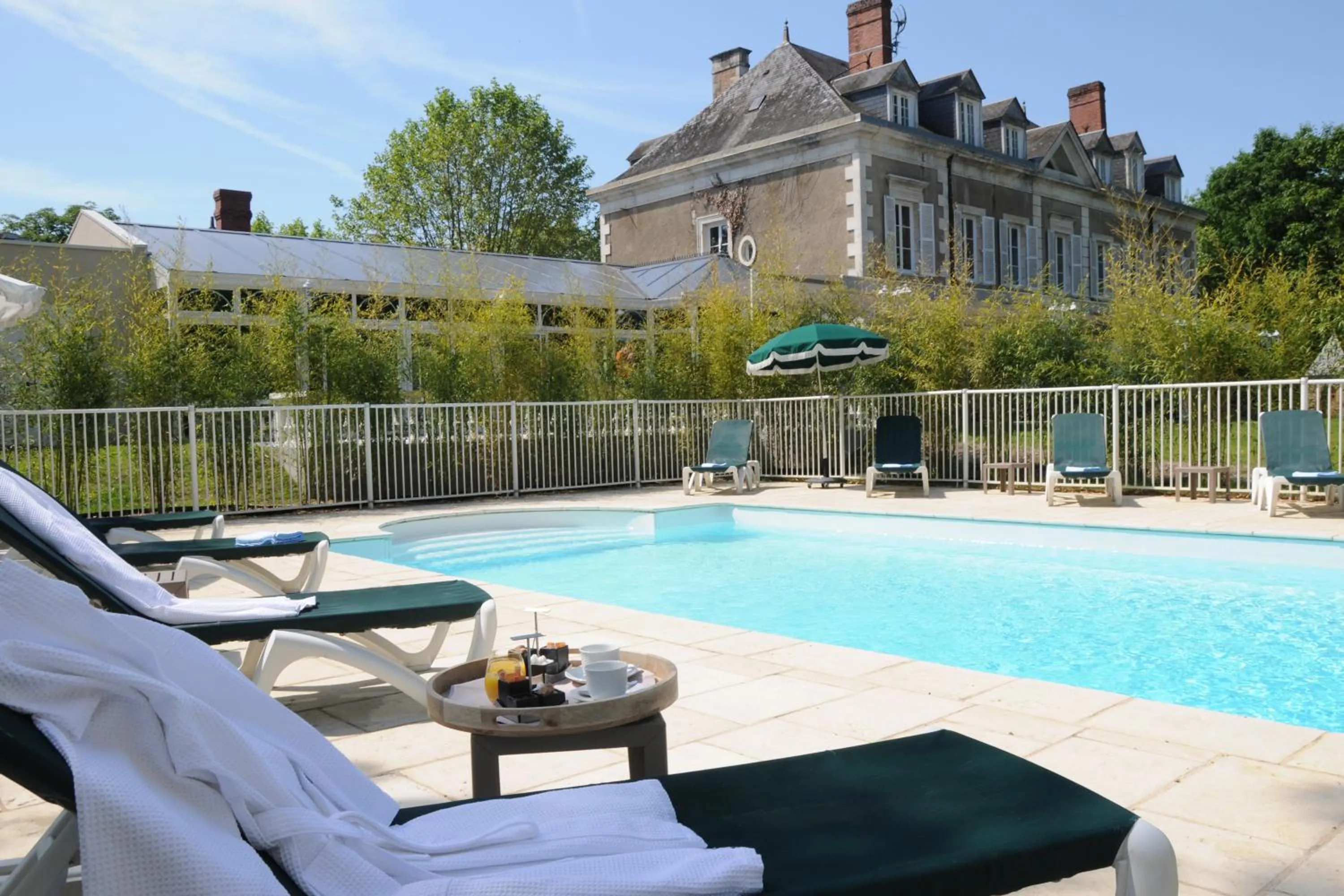 Swimming pool in Logis Domaine De Valaudran