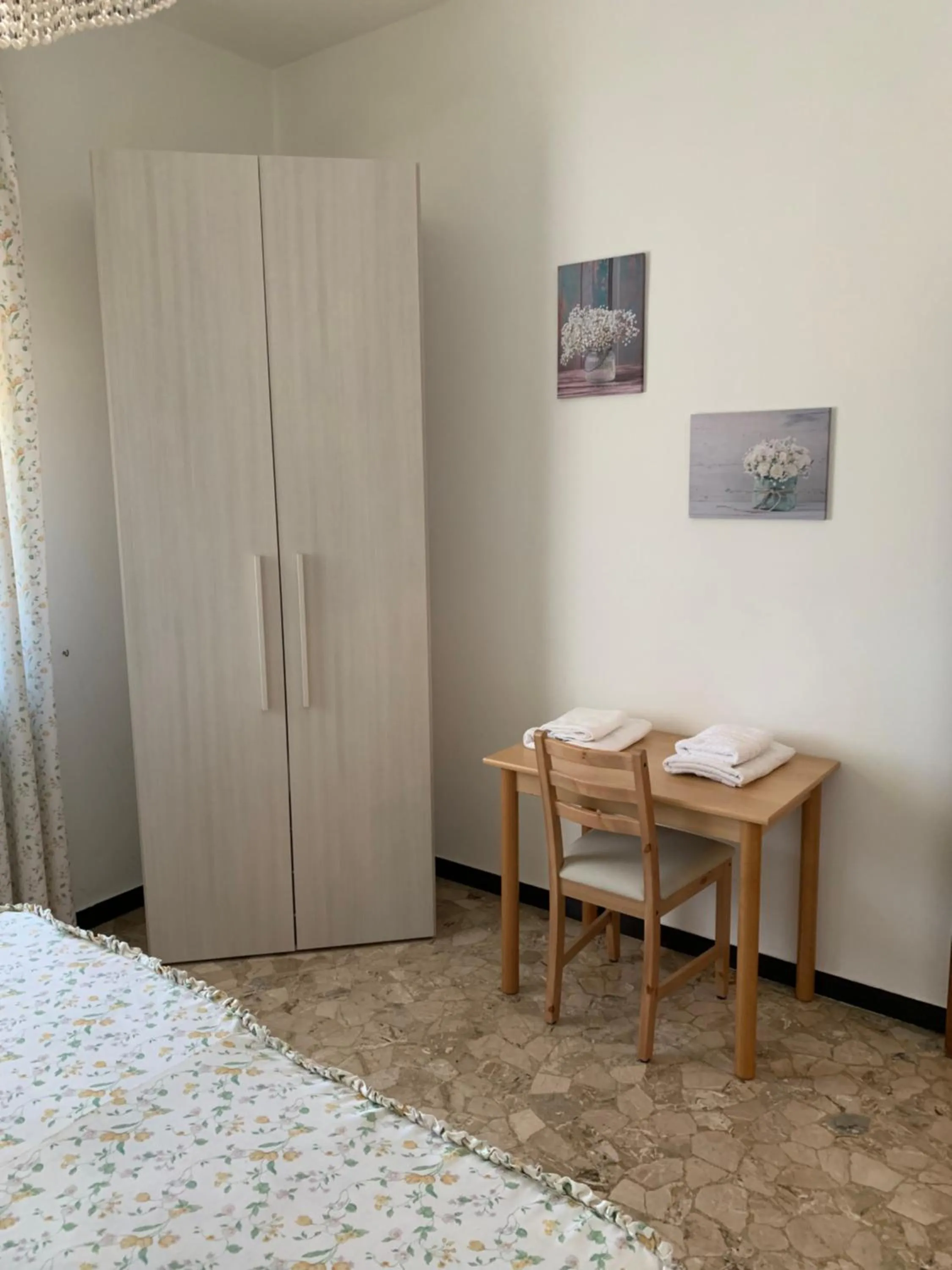 Bedroom in Affittacamere Serravalle Shopping