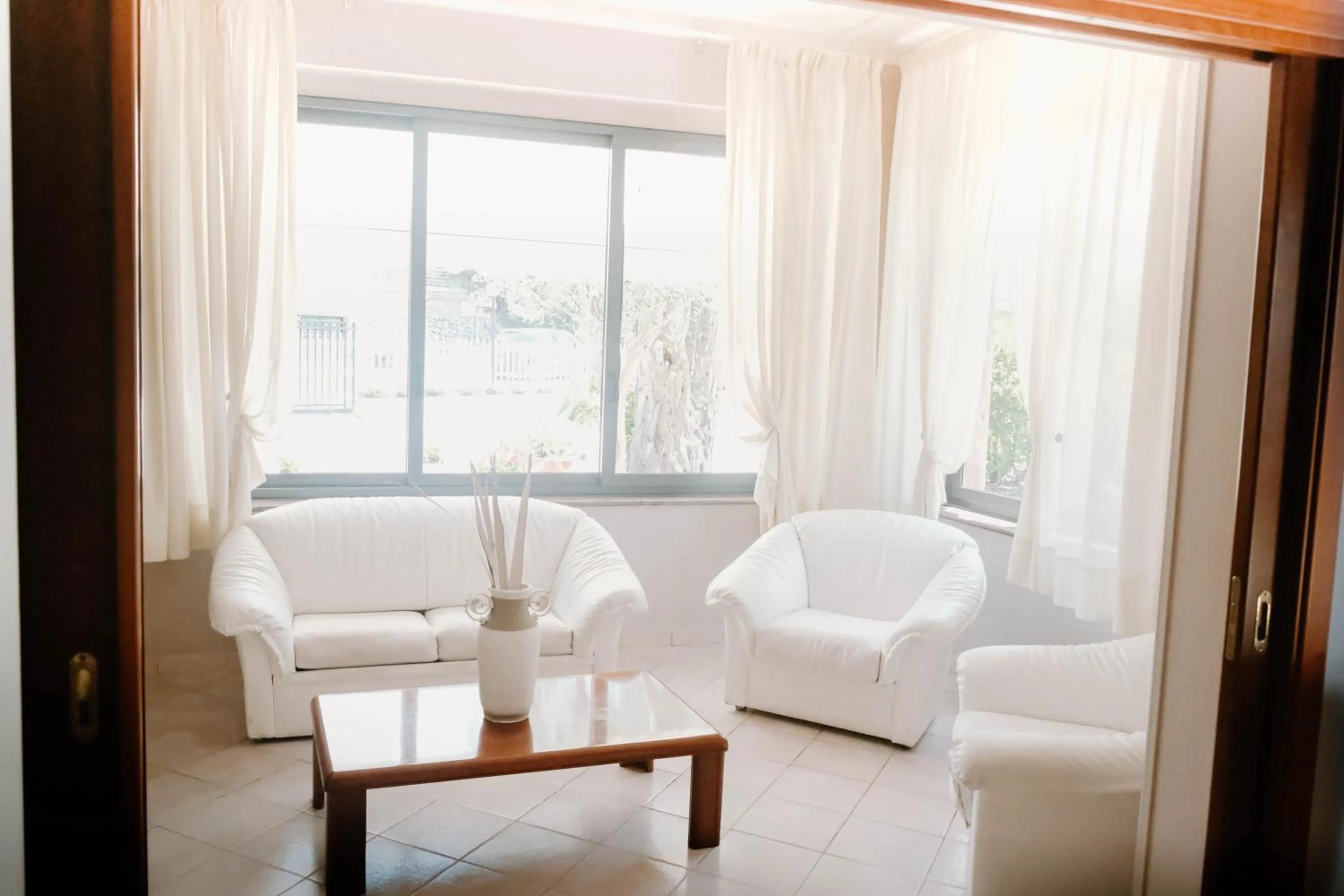 Communal lounge/ TV room in Beach Hotel Terracotta