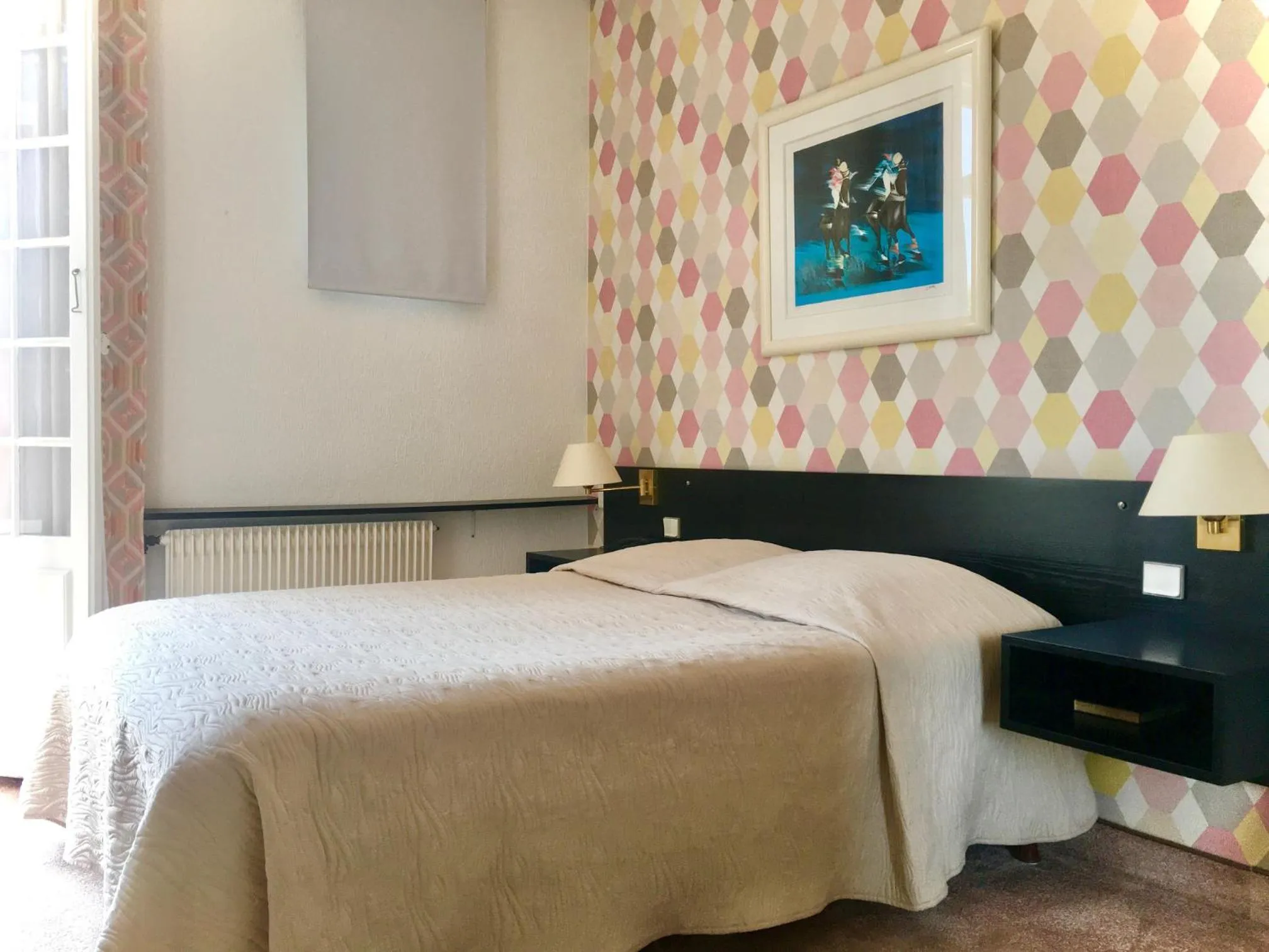 Bed in Hotel des Mimosas