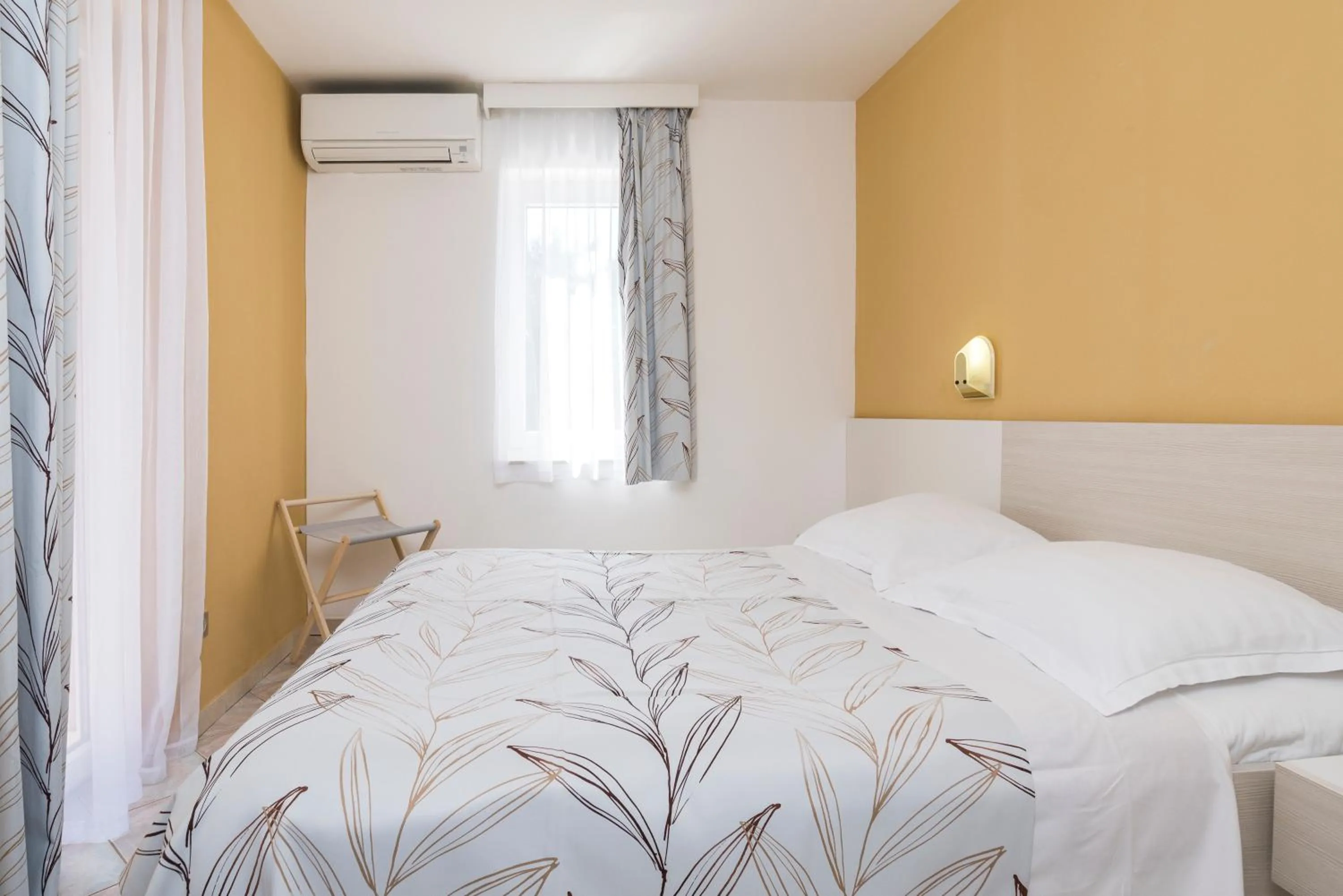 Bed in Apartments Amfora Plava Laguna