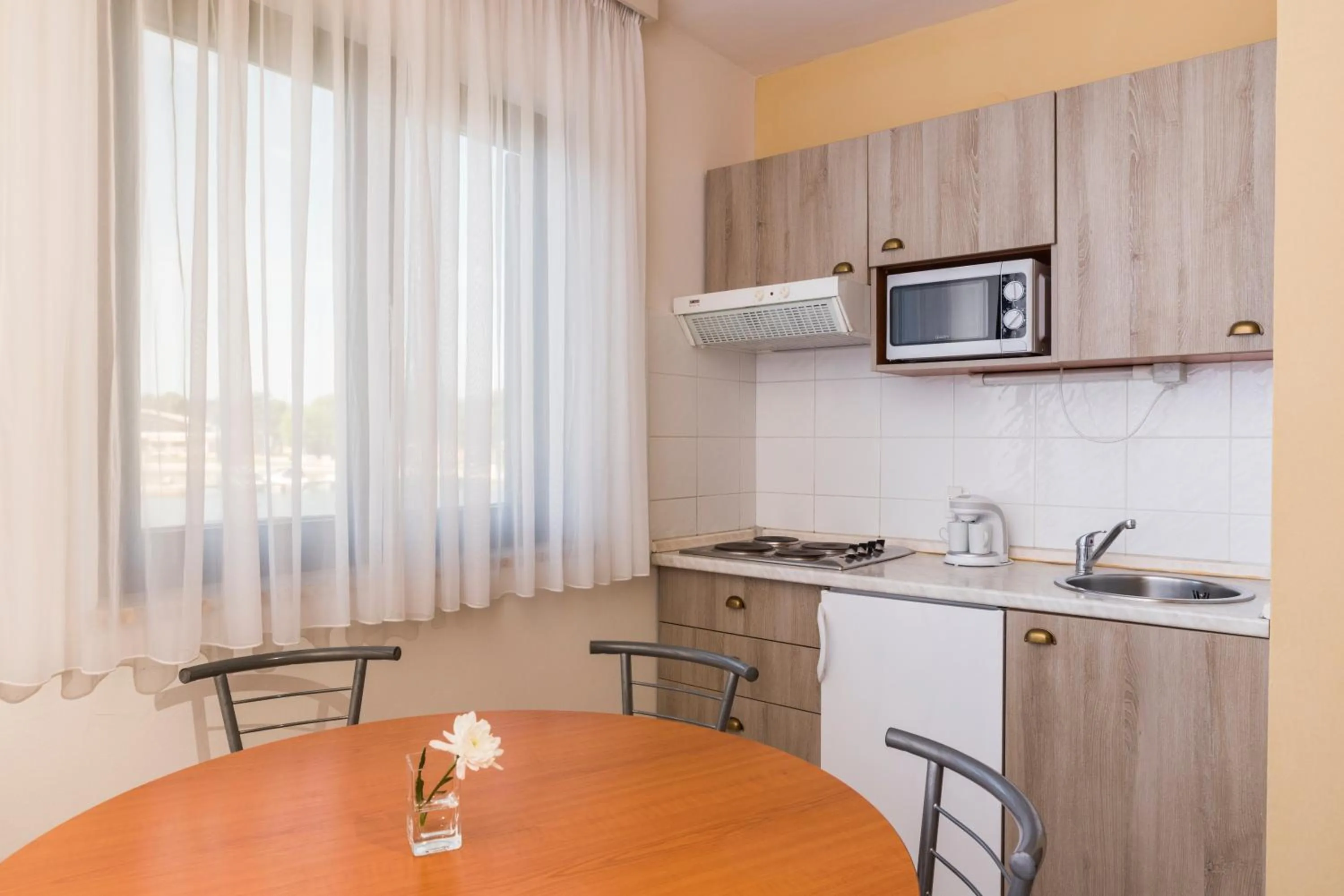 Kitchen or kitchenette in Apartments Amfora Plava Laguna