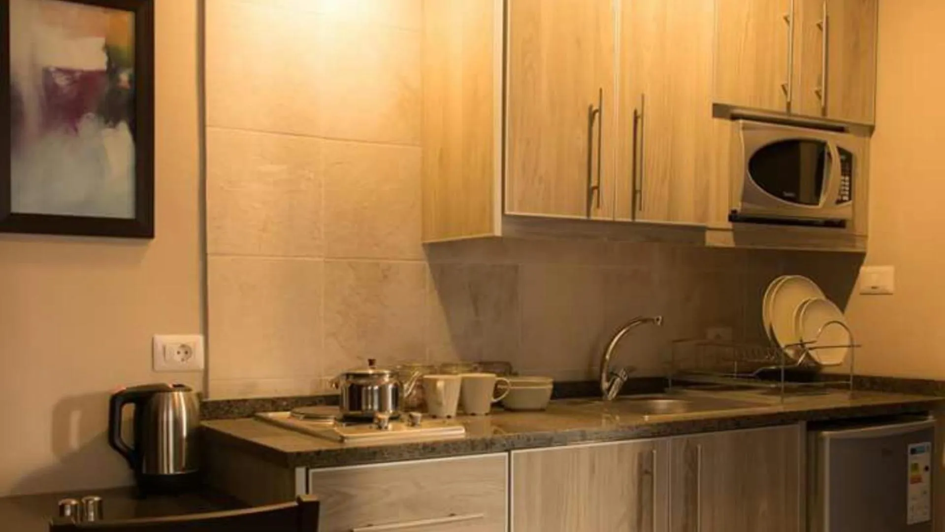 Kitchen or kitchenette in Shams Alweibdeh Hotel Apartments