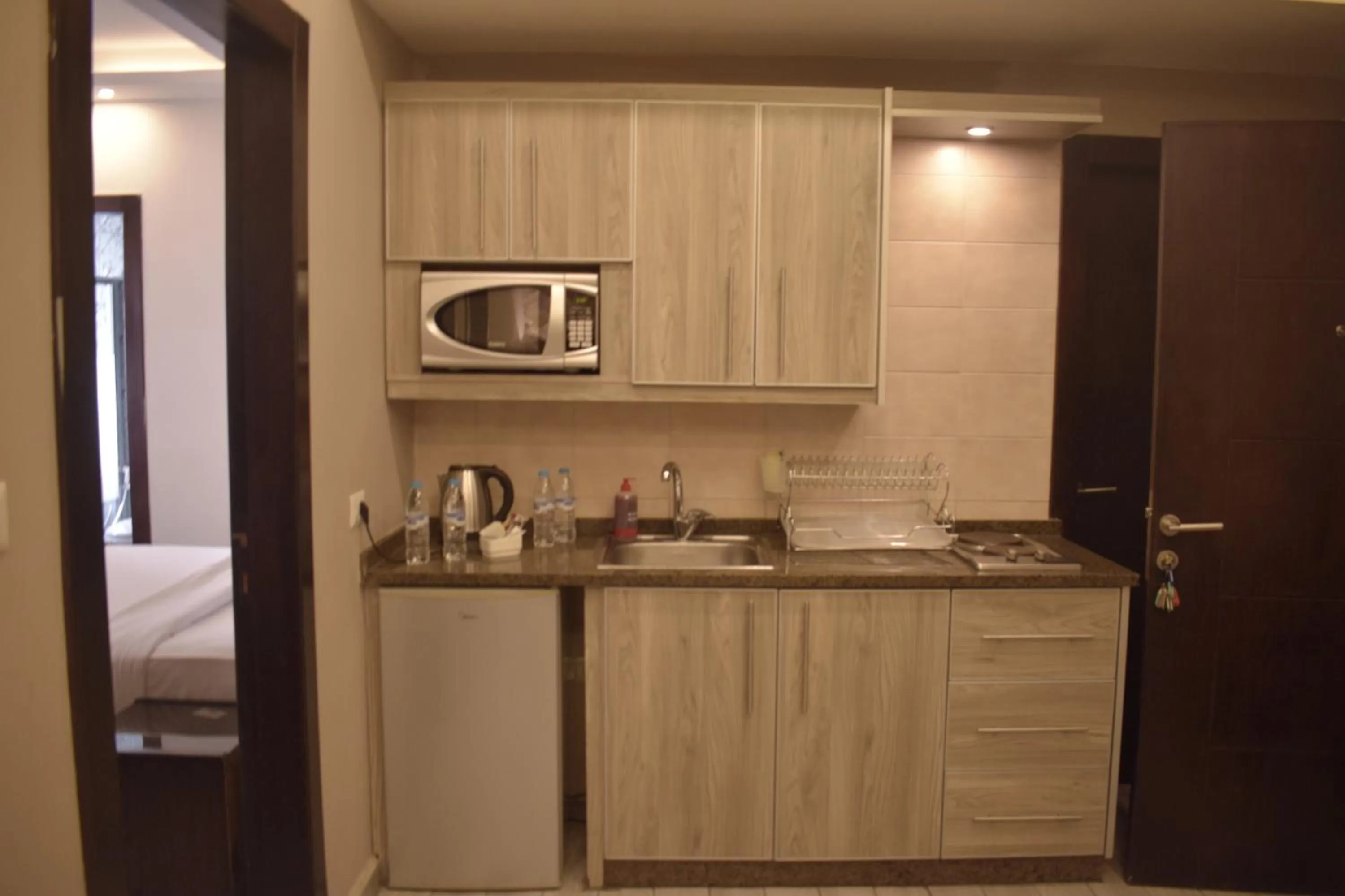 Kitchen or kitchenette in Shams Alweibdeh Hotel Apartments