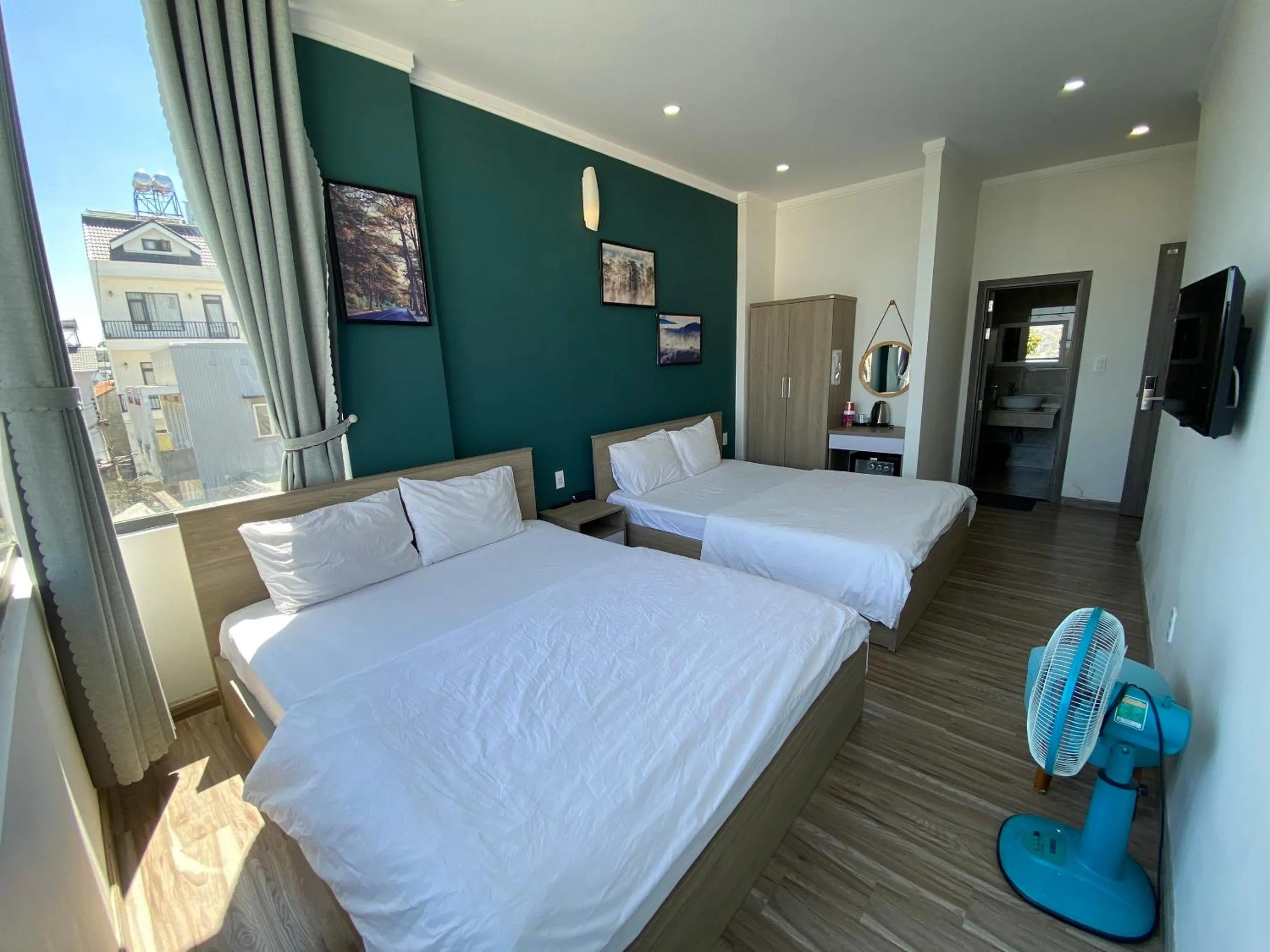 Communal lounge/ TV room, Bed in Dalat Memory Inn