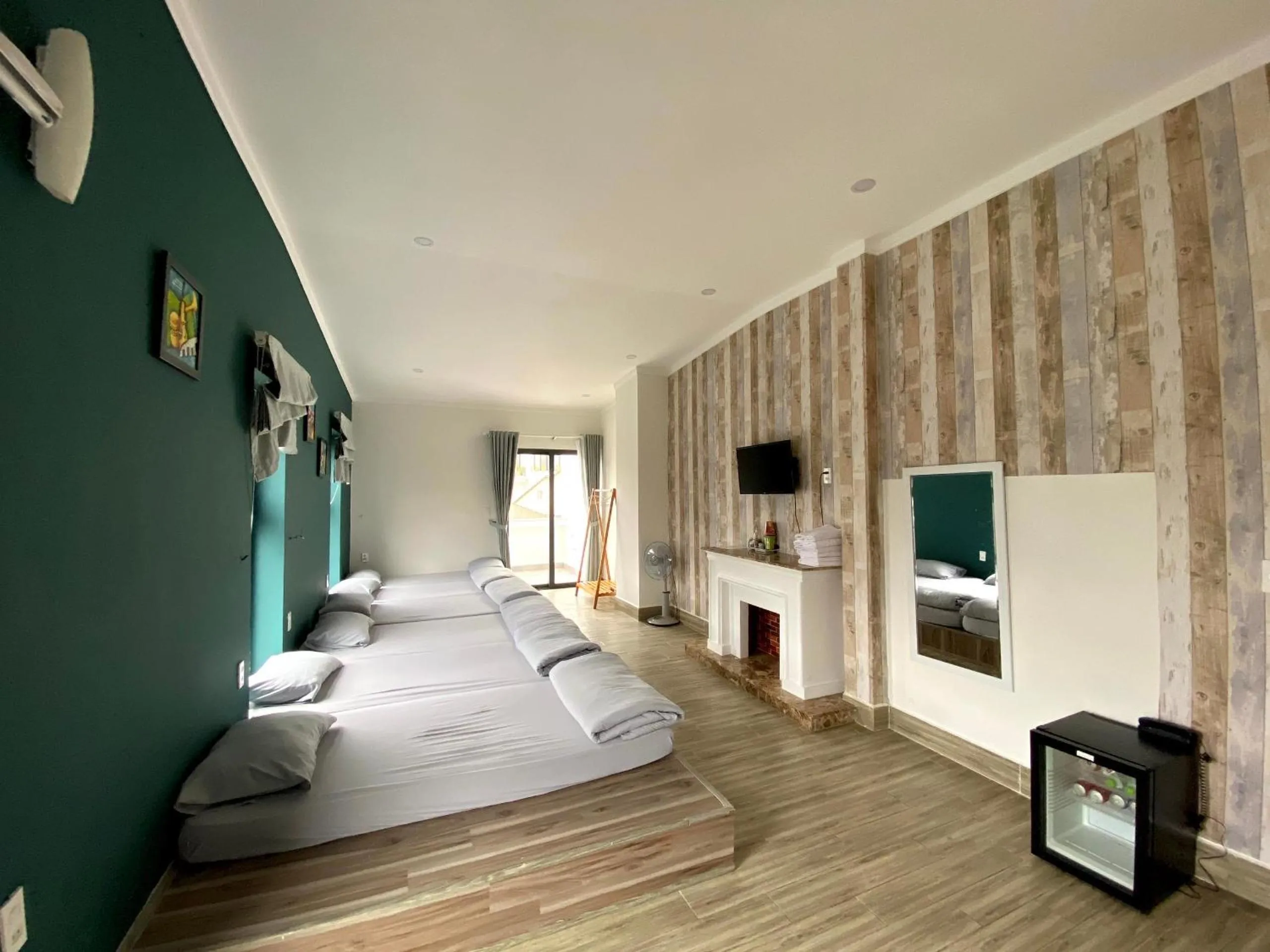 Communal lounge/ TV room, Bed in Dalat Memory Inn