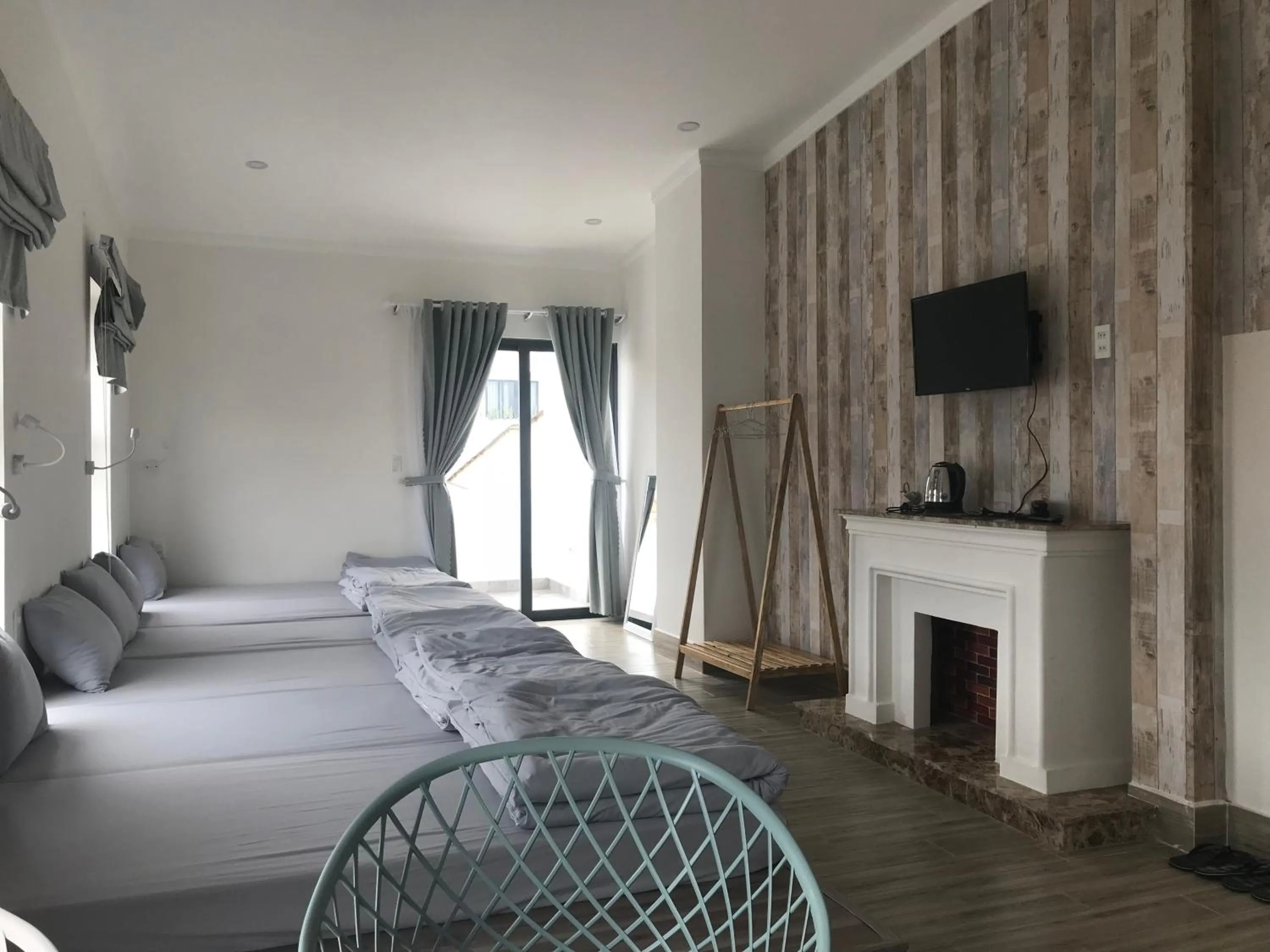 Communal lounge/ TV room, Bed in Dalat Memory Inn