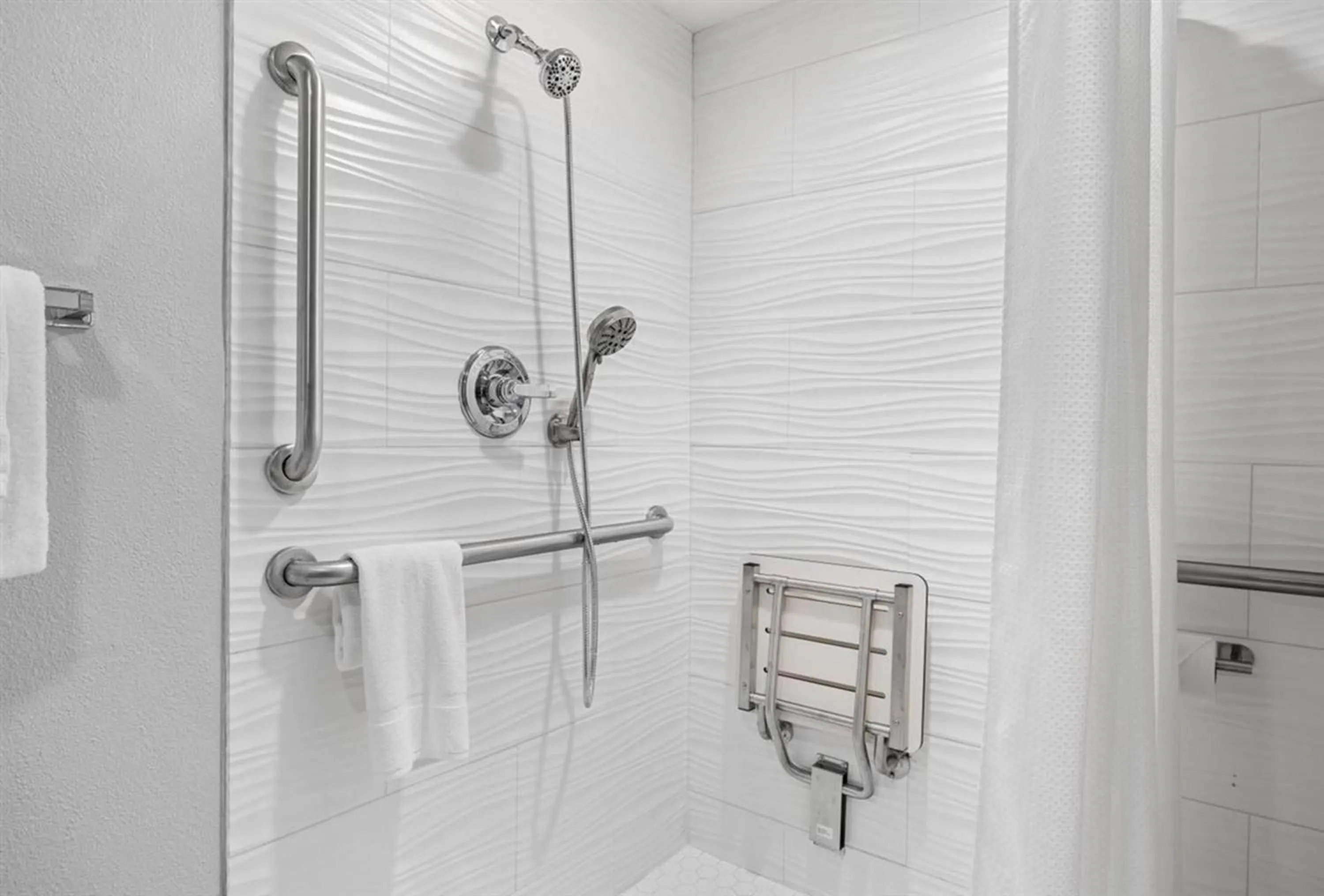 Bathroom in Prodigy Hotel, a Days Inn by Wyndham