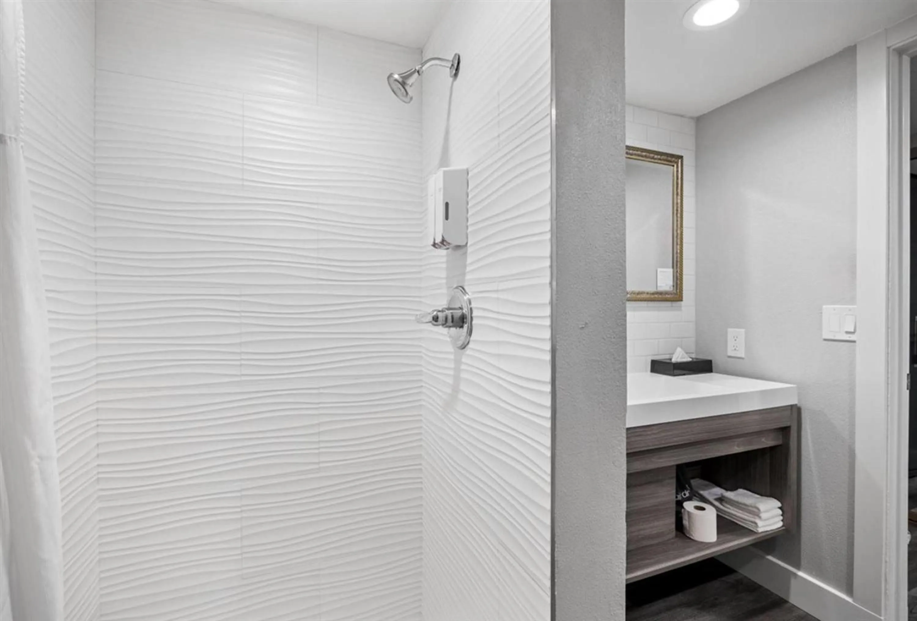 Bathroom in Prodigy Hotel, a Days Inn by Wyndham
