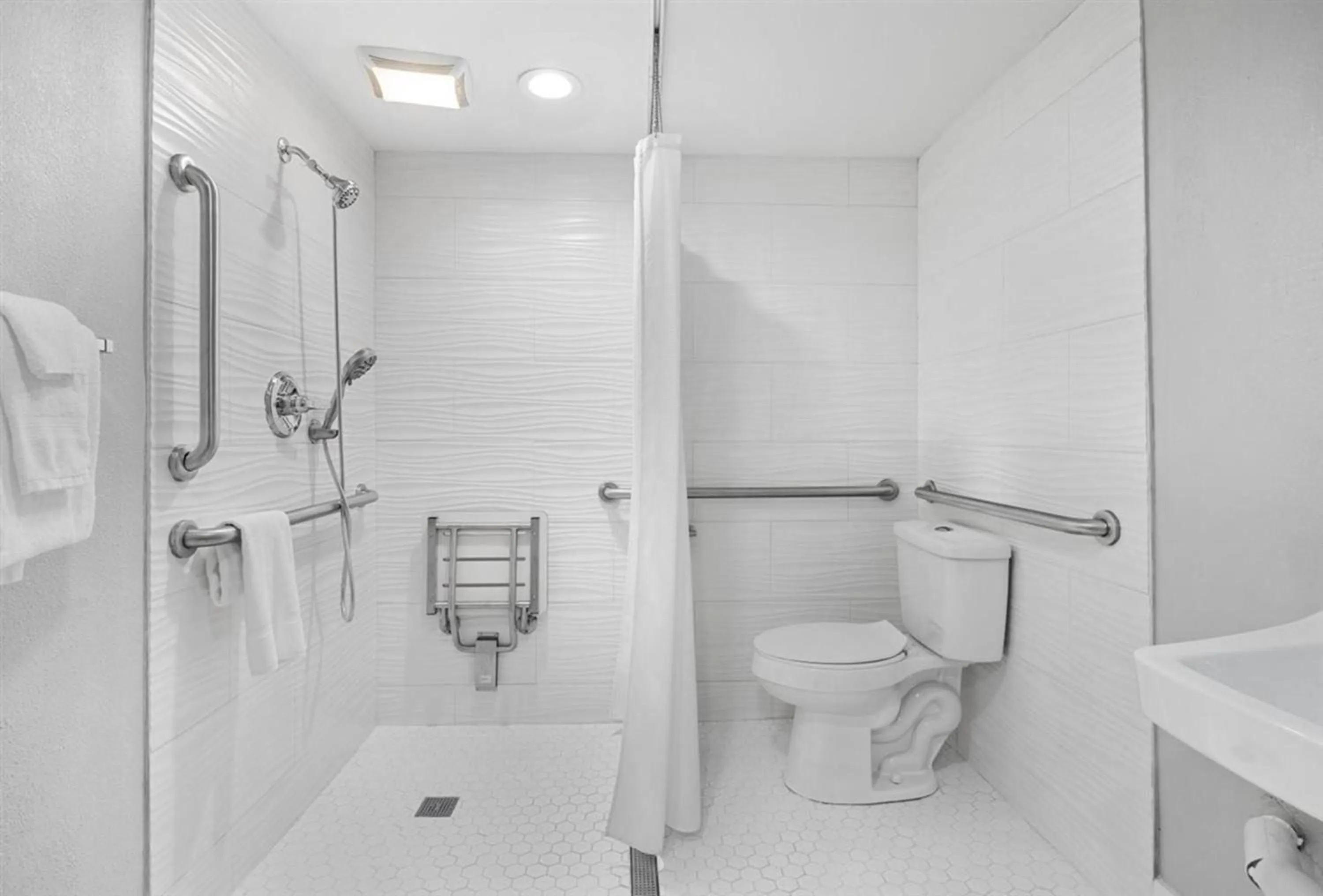 Bathroom in Prodigy Hotel, a Days Inn by Wyndham