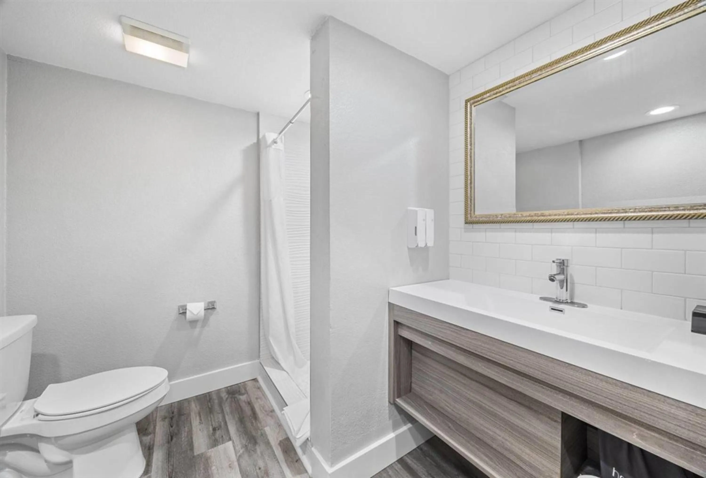 Bathroom in Prodigy Hotel, a Days Inn by Wyndham