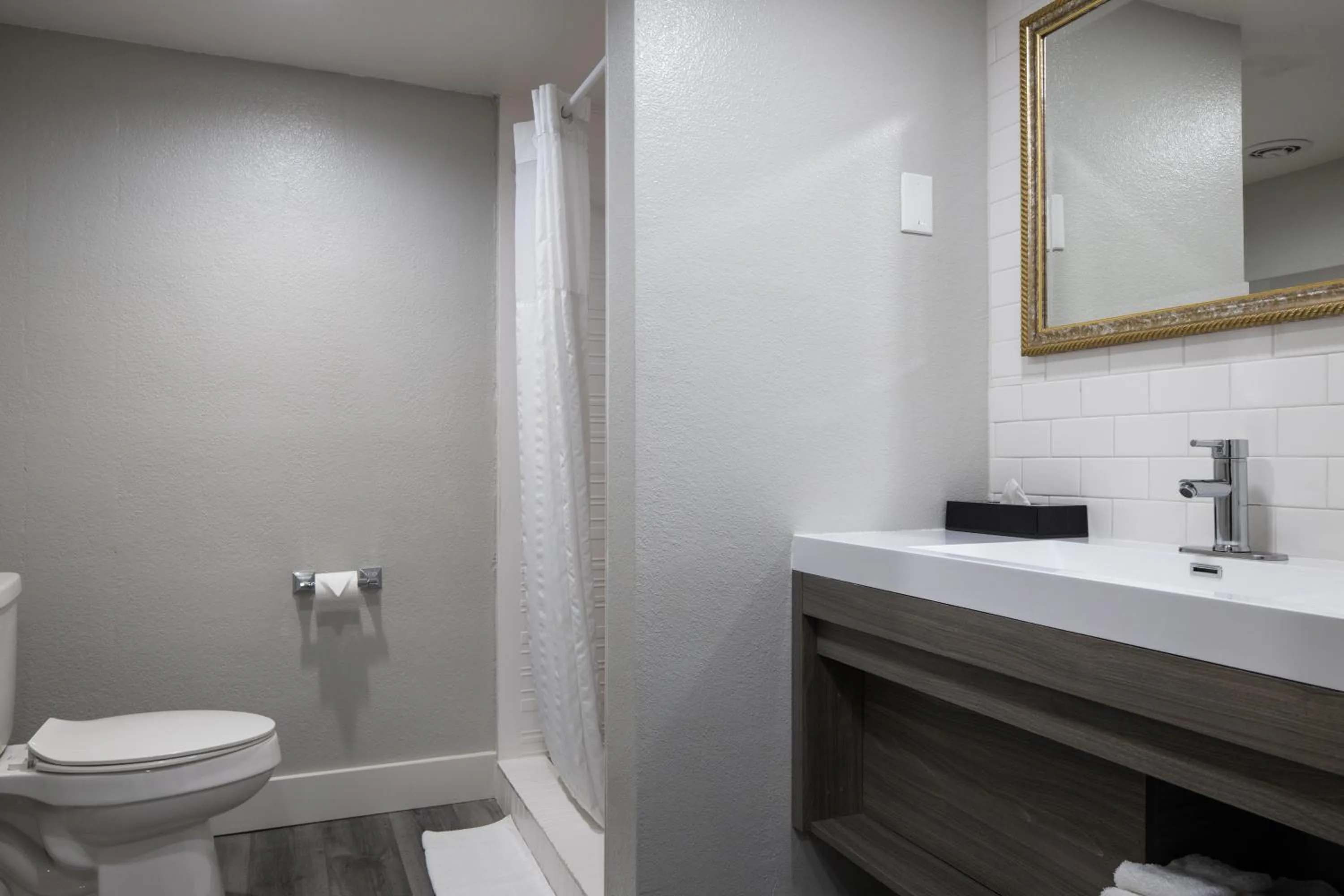 Bathroom in Prodigy Hotel, a Days Inn by Wyndham