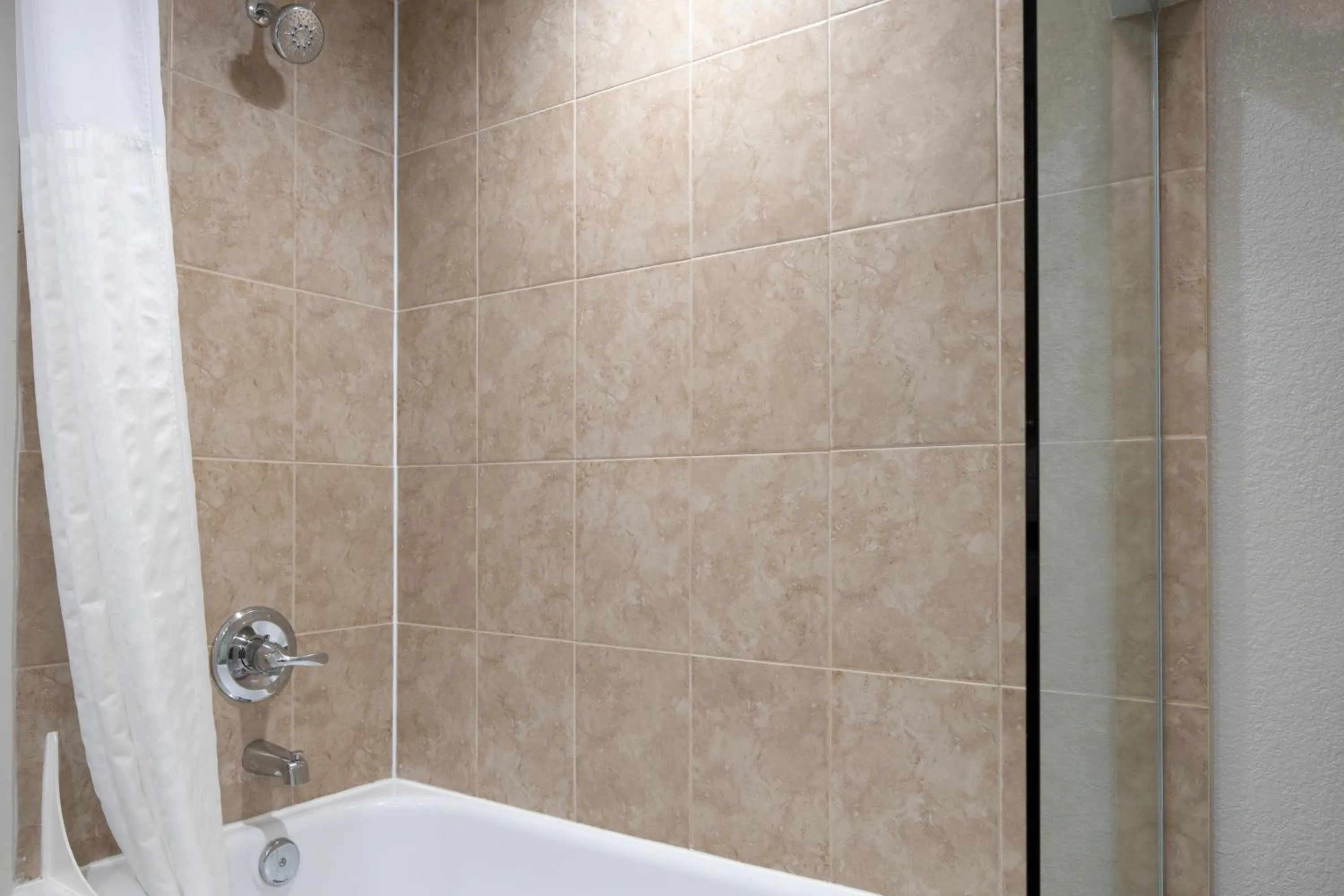 Bathroom in Prodigy Hotel, a Days Inn by Wyndham