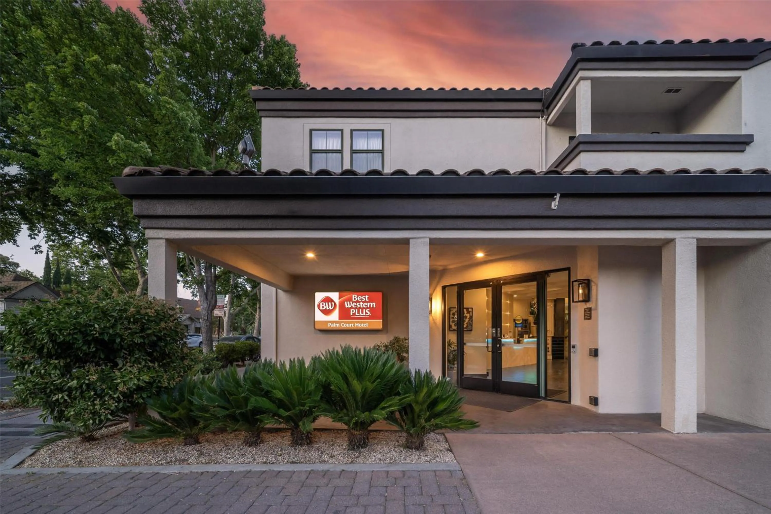 Property building in Best Western Plus Palm Court Hotel