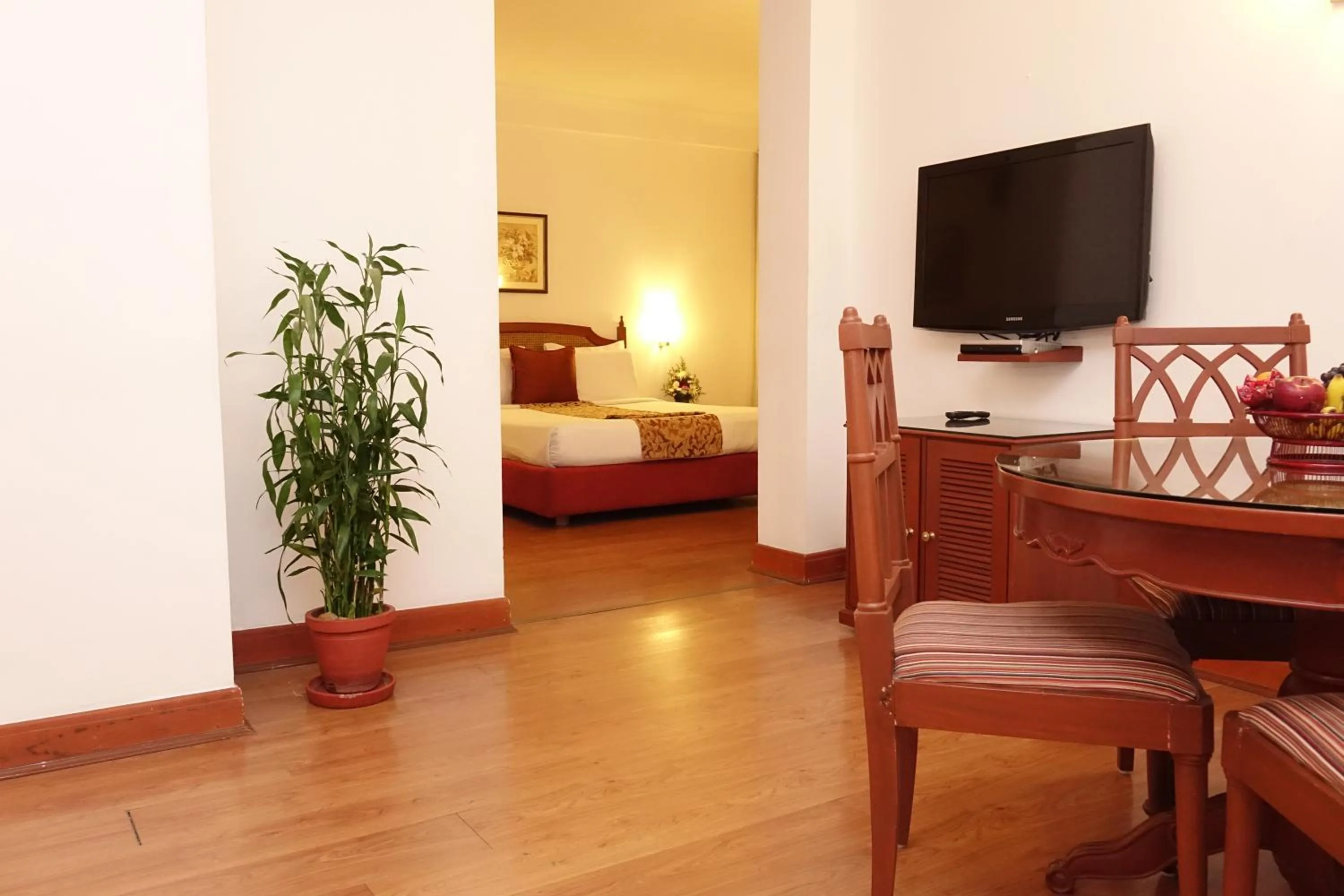 Living room, Bed in Abad Atrium