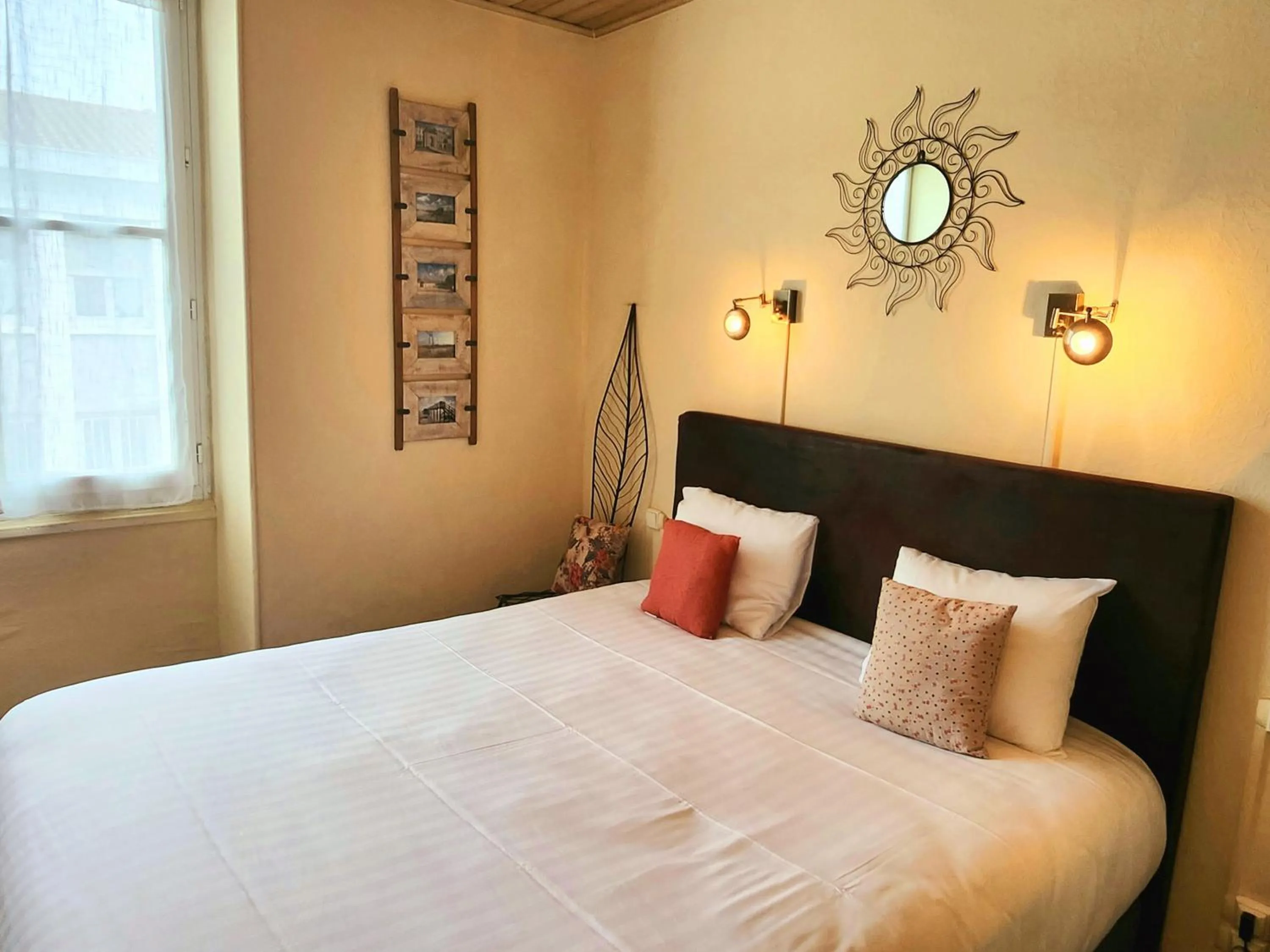 Bed in Logis Hôtel Lafayette Rochefort France