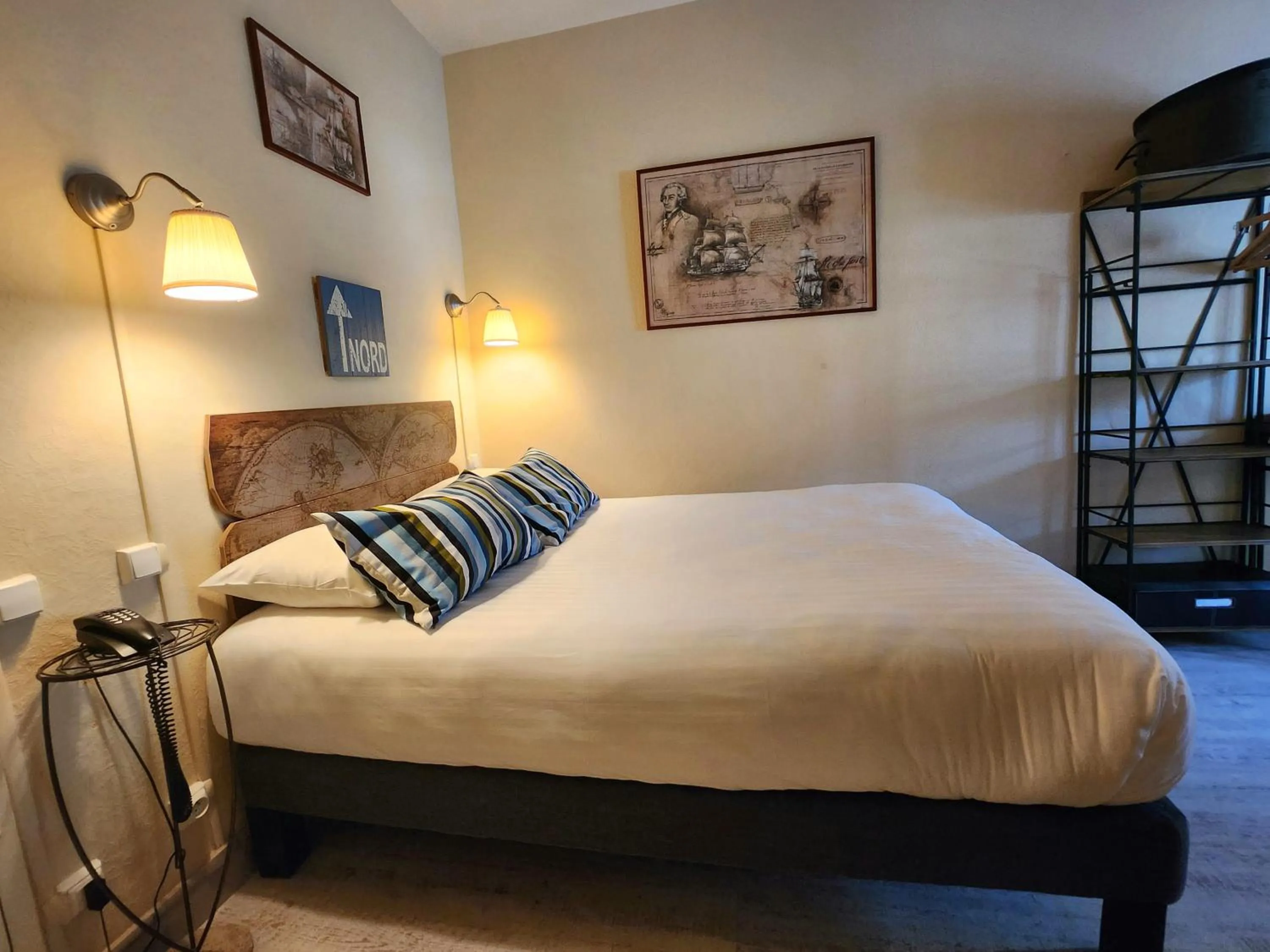 Bed in Logis Hôtel Lafayette Rochefort France