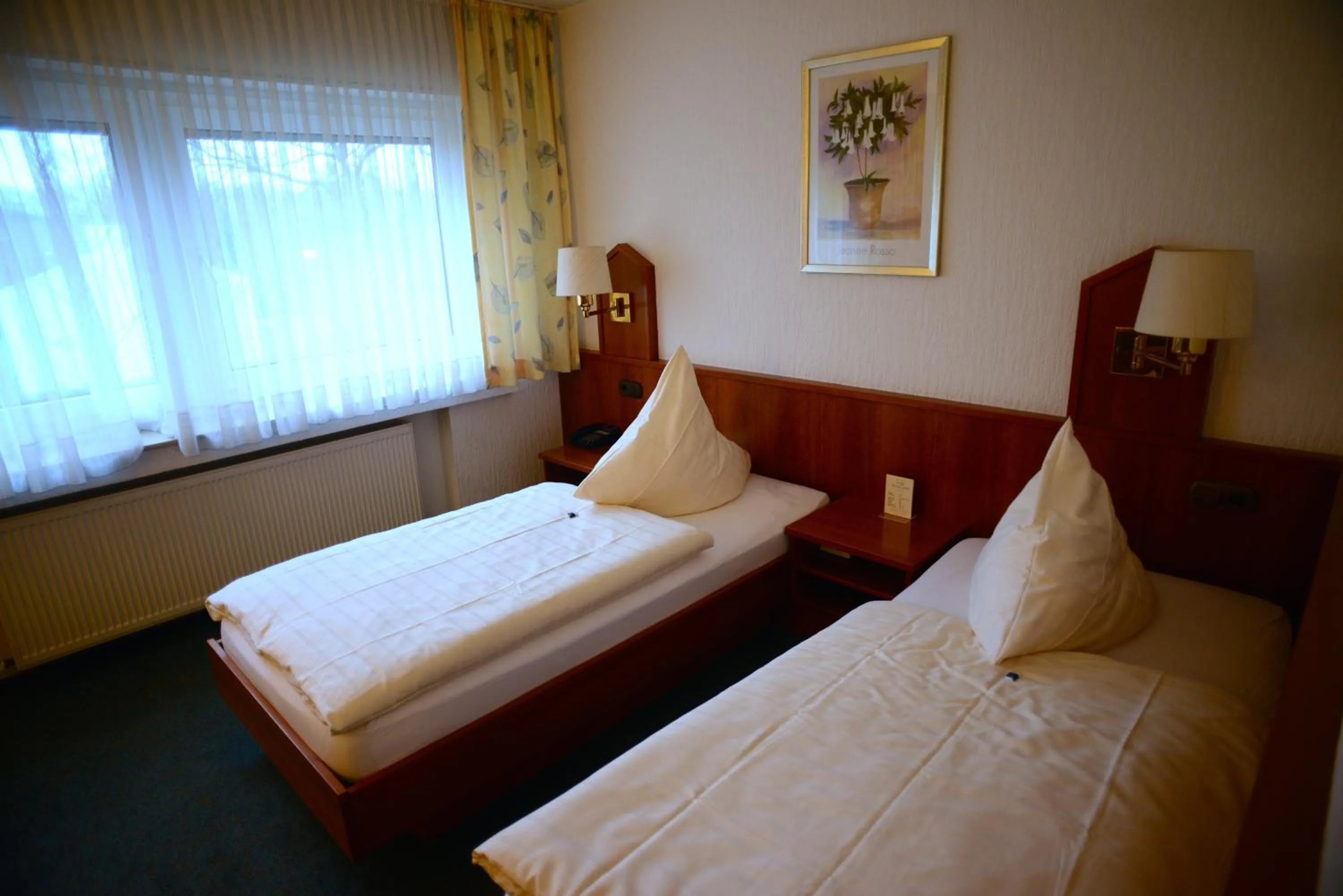 Bed in Hotel Marienhof Düsseldorf Neuss