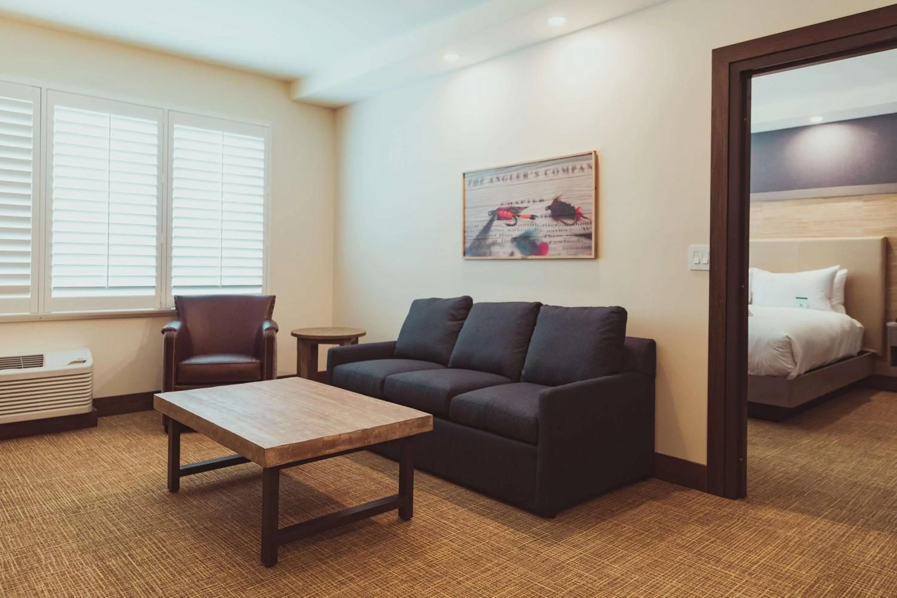 Living room, Bed in Tailwater Lodge Altmar, Tapestry Collection By Hilton