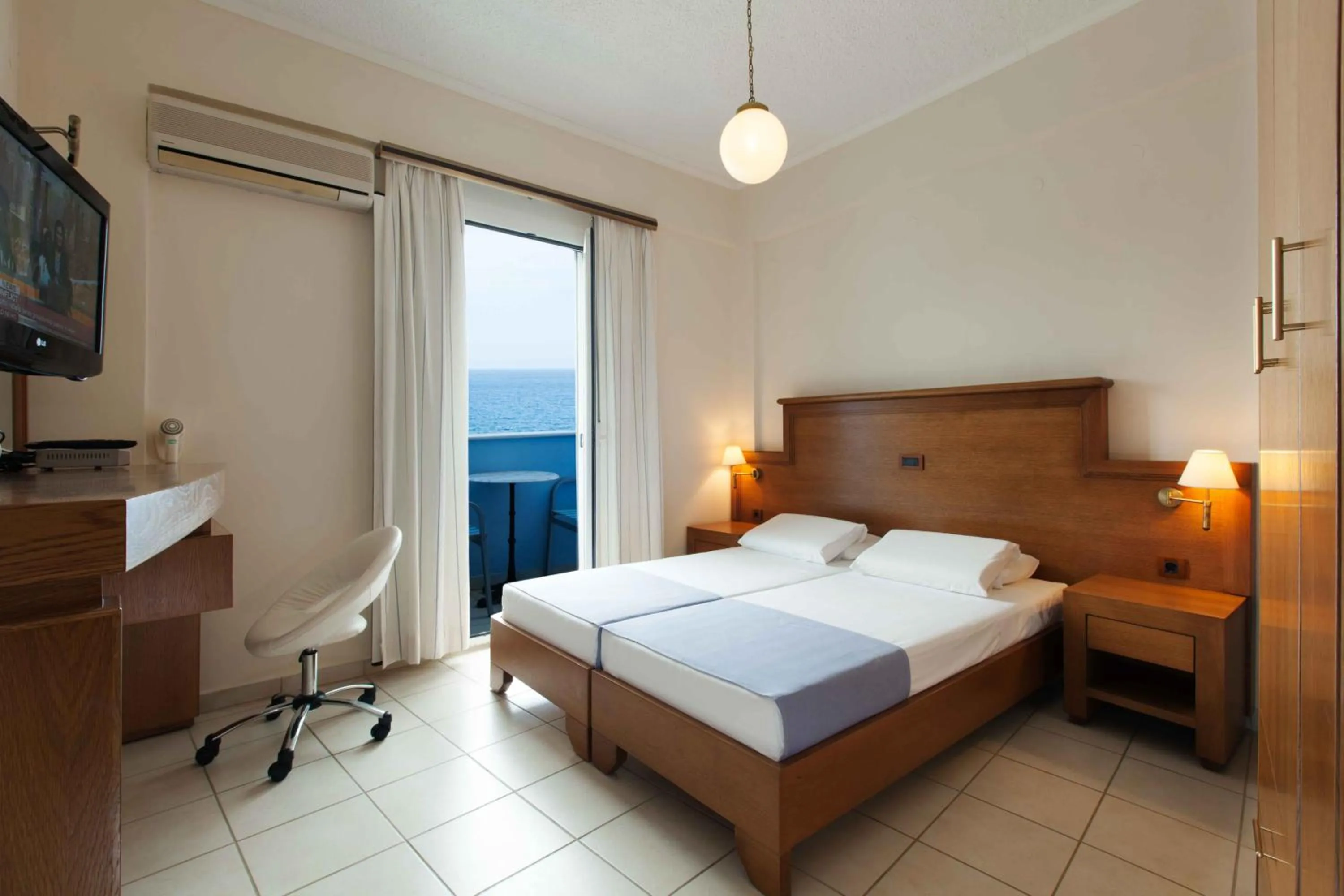 Bed in Giorgi's Blue Apartments