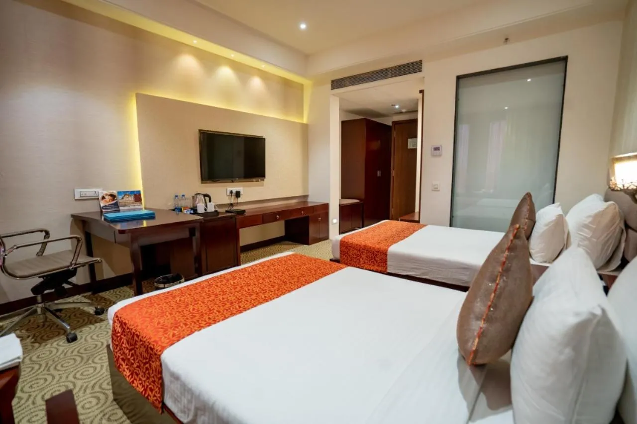 Communal lounge/ TV room, Bed in Pride Hotel & Convention Centre Indore