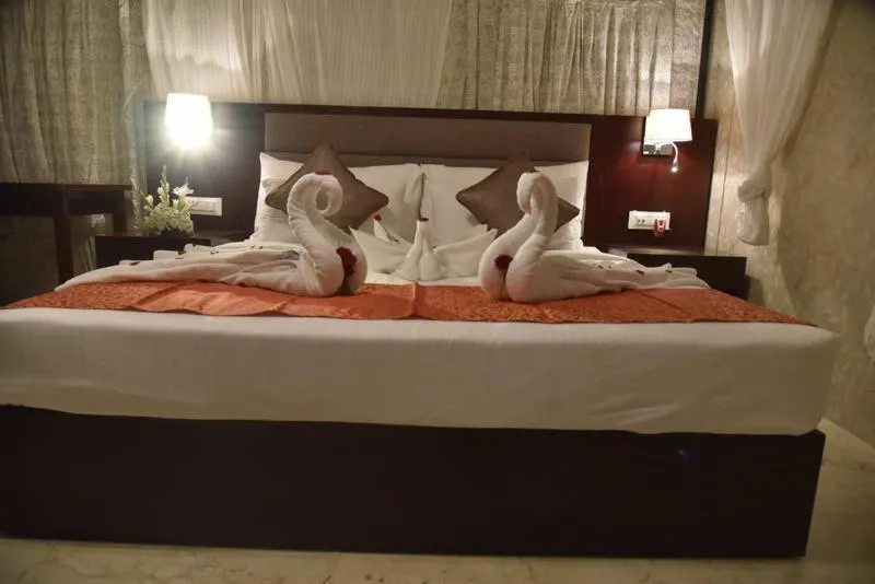 Staff, Bed in Pride Hotel & Convention Centre Indore